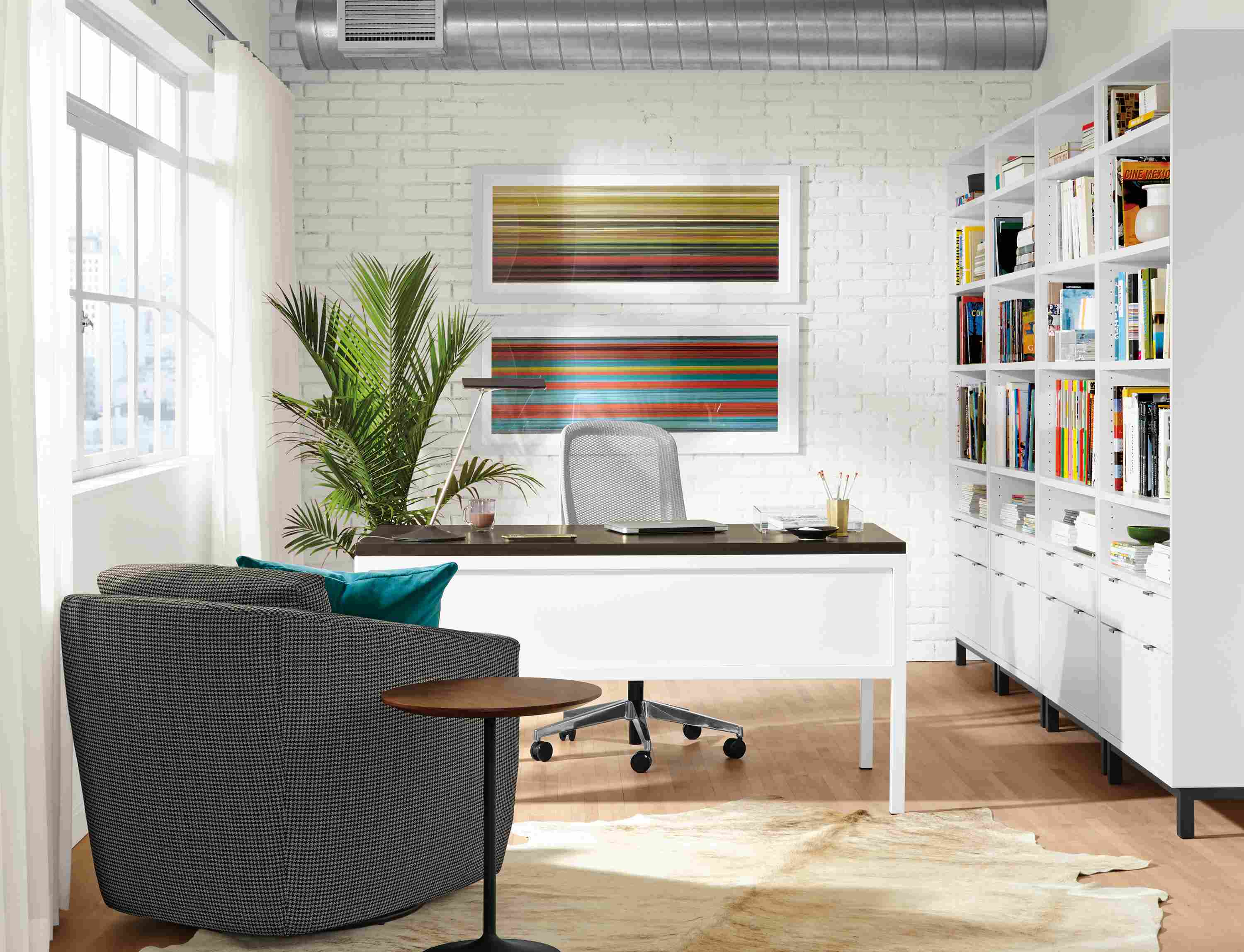 Office with Ramsey desk in white with charcoal top and 4 Copenhagen bookcases in white.
