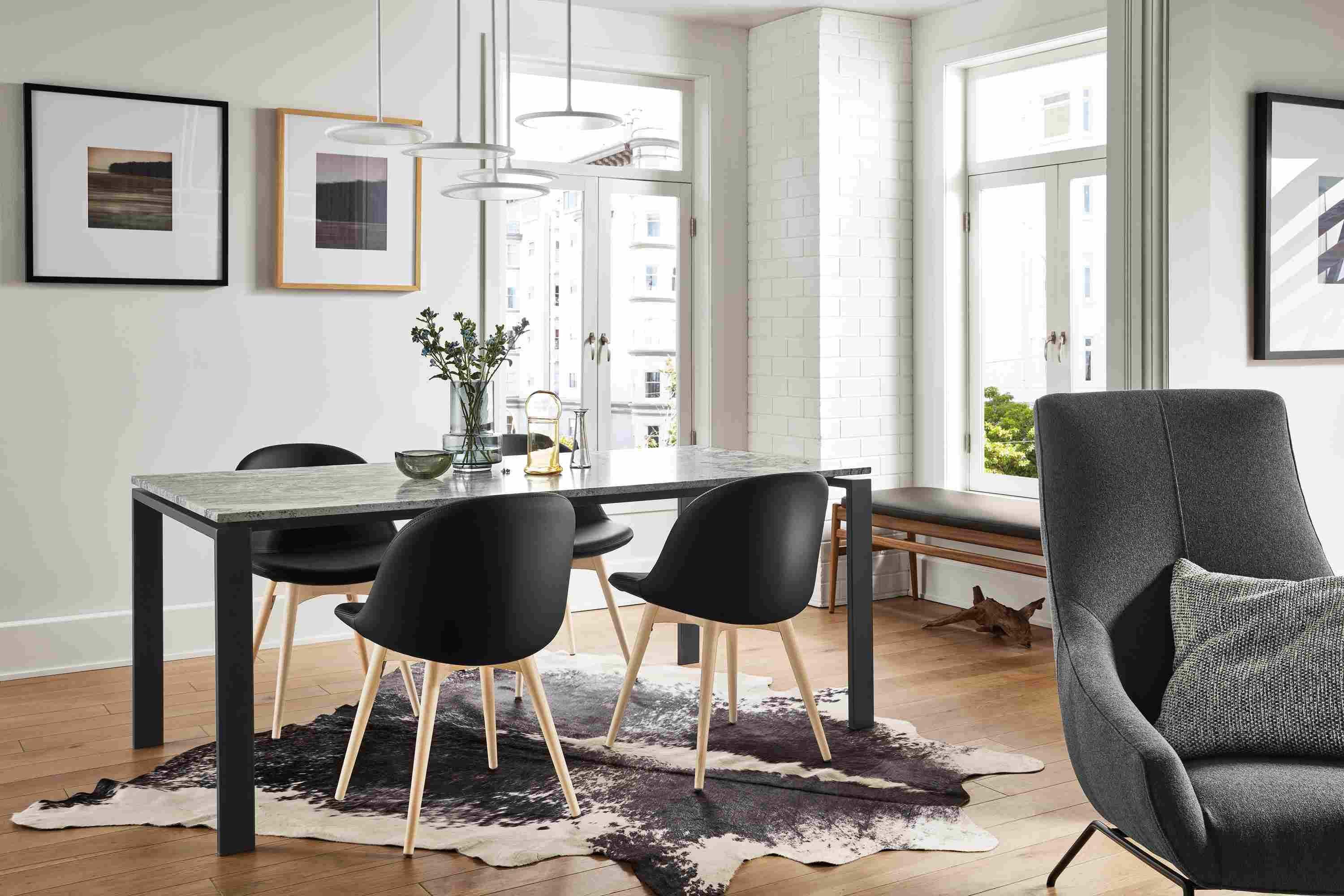 Great room with Rand dining table with natural steel base and Wiscont White top.