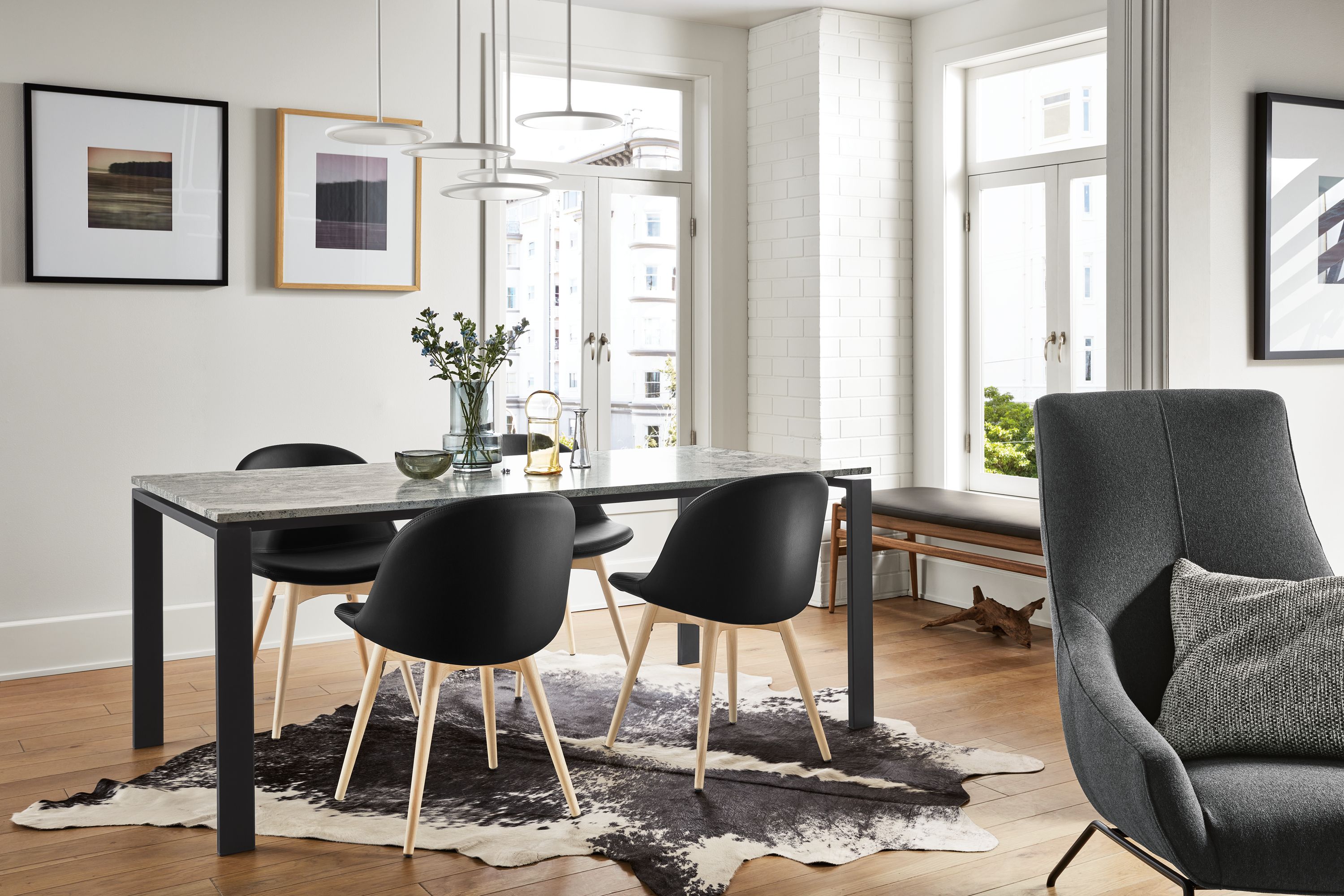 dining room featuring rand dining table with natural steel base and quartz top