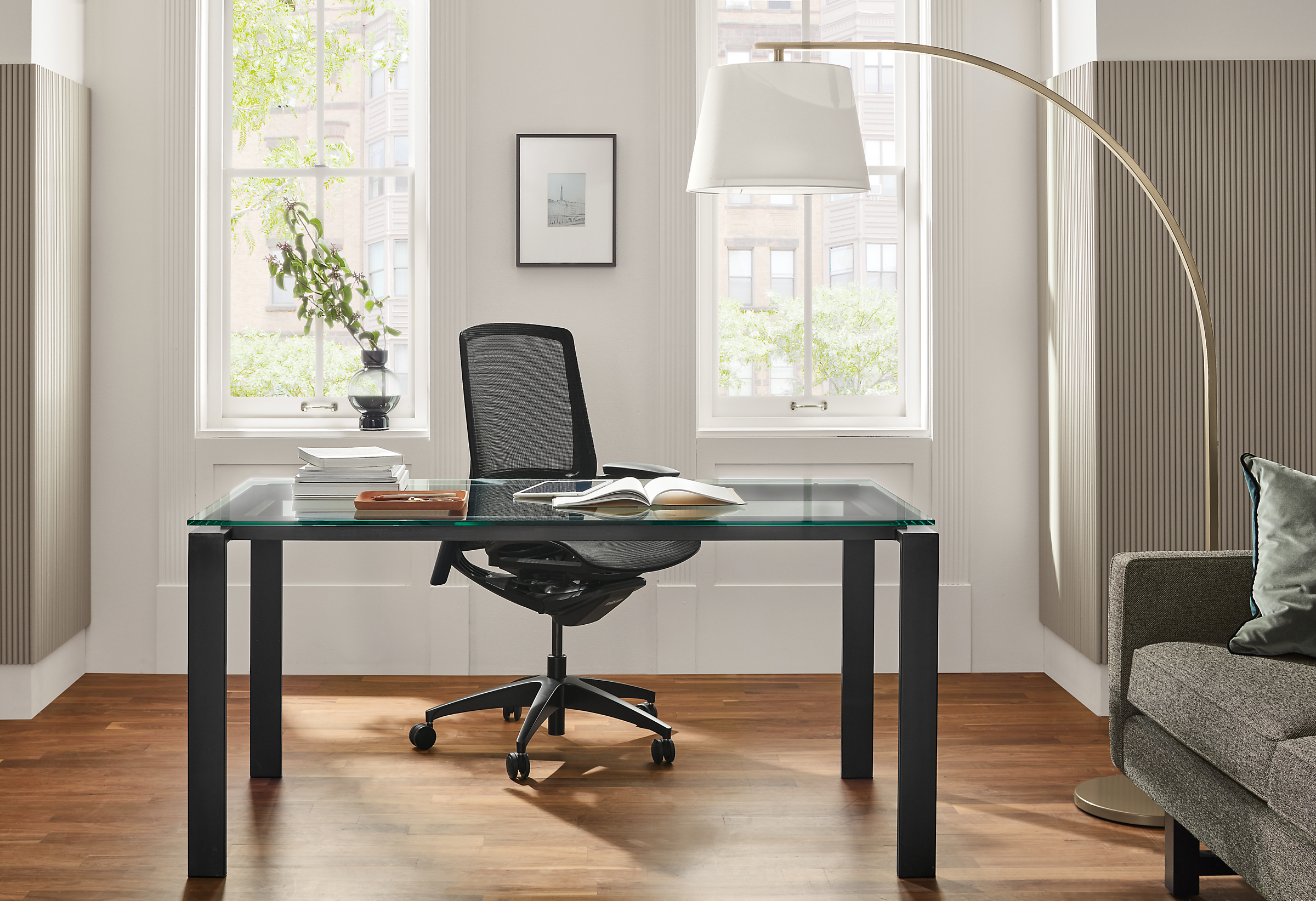 Office setting with Rand 60-wide table in Natural steel with Finora Office chair.