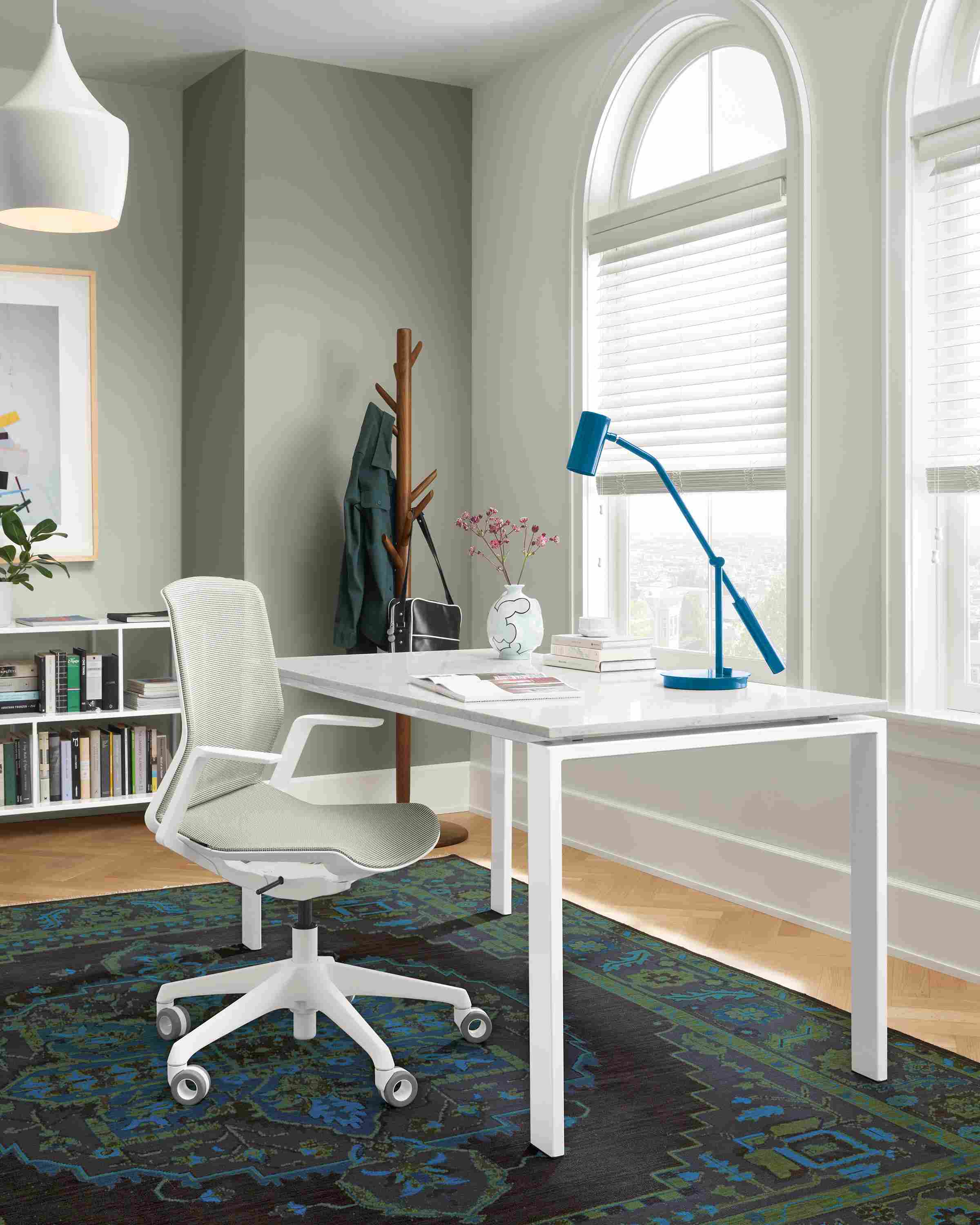 Office with Rand table in white with marbled white quartz top, Cynara office chair, Heriz rug in ink.