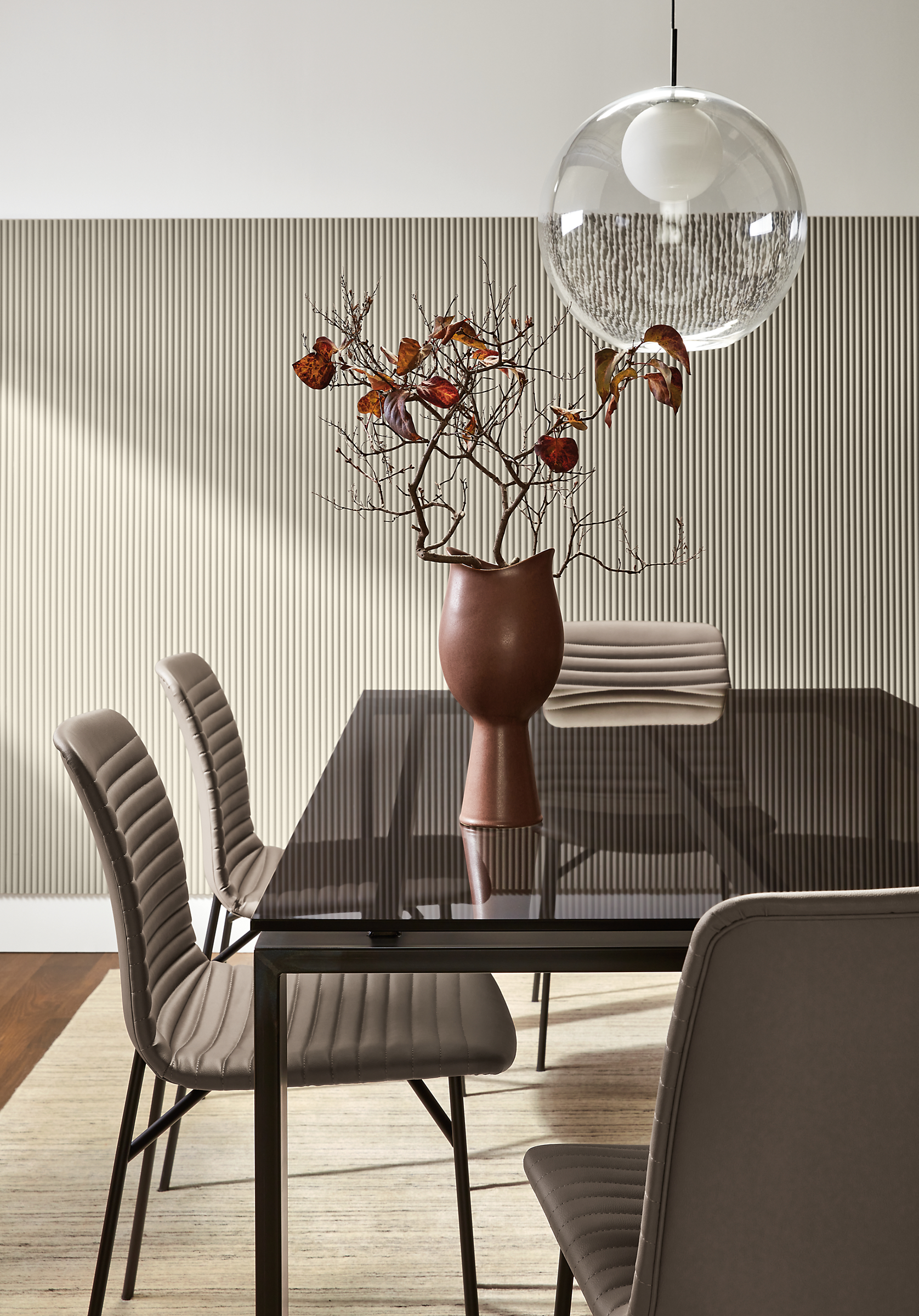 Dining room with Rand 78-wide table with Cato side table in putty synthetic leather.