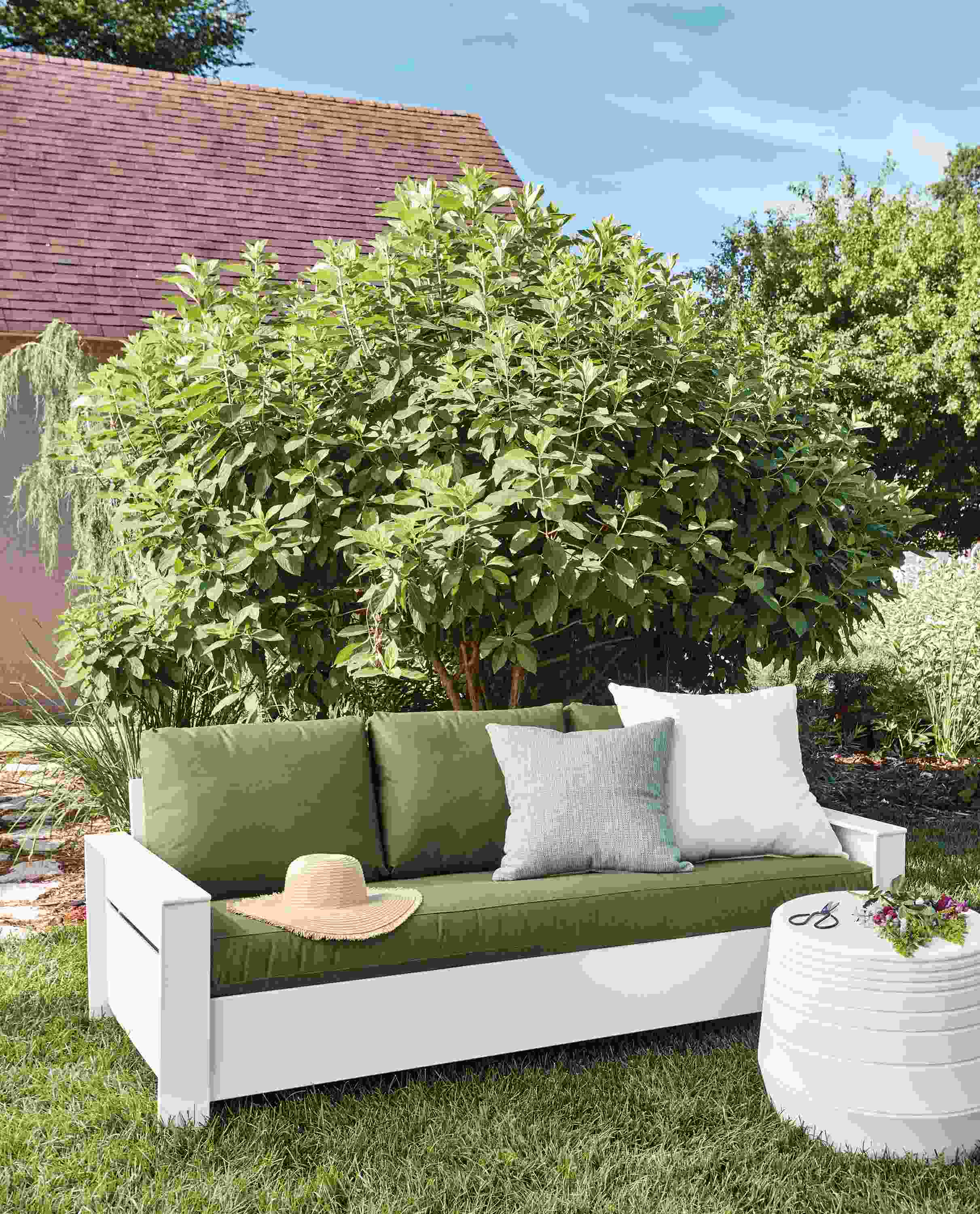 Outdoor setting with Rayo 75-inch sofa in White with Sunbrella Canvas Fern cushions.