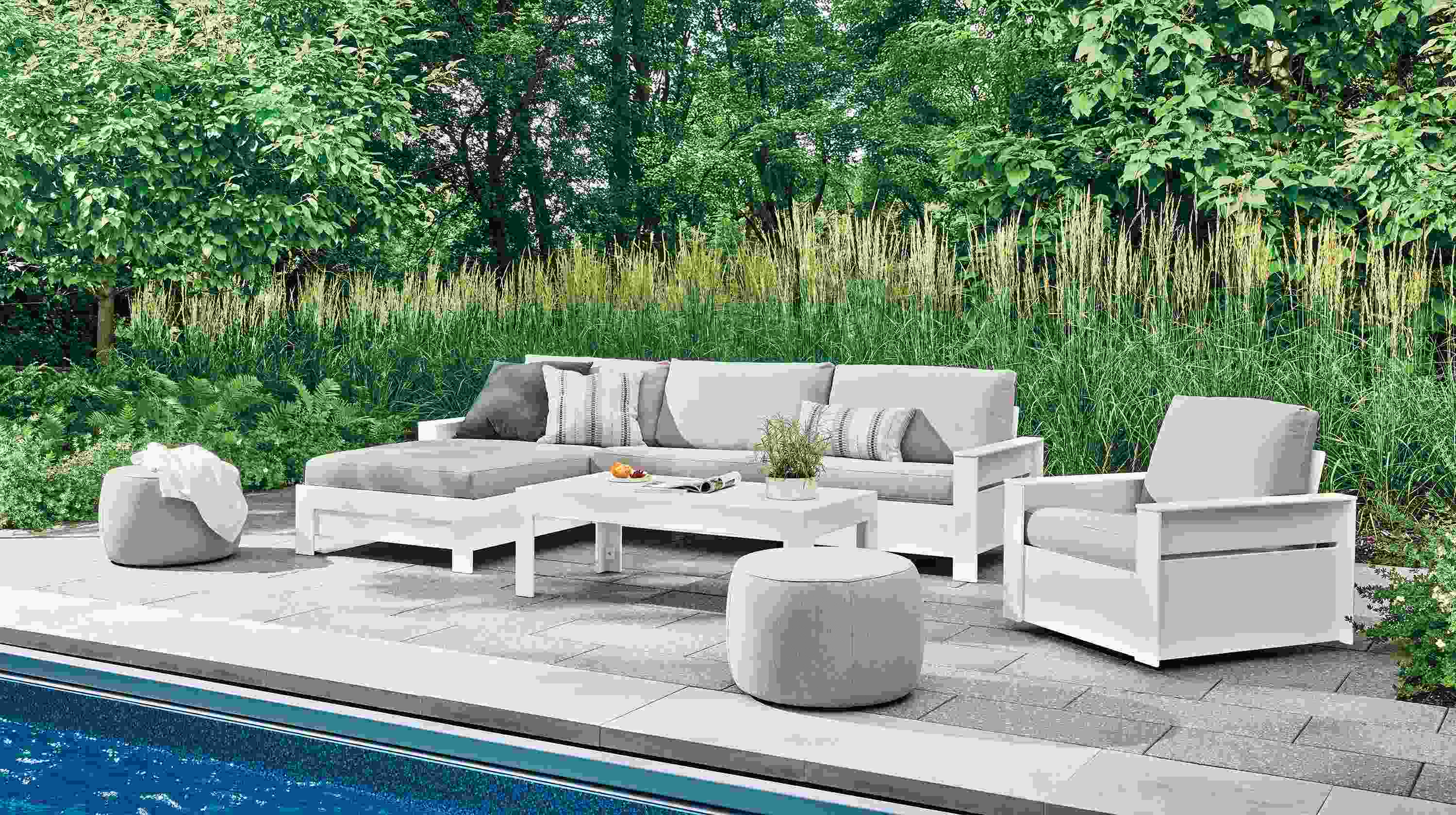 Poolside patio with Rayo left-arm chaise and swivel chair in Mist Grey and white HDPE and Henry coffee table.