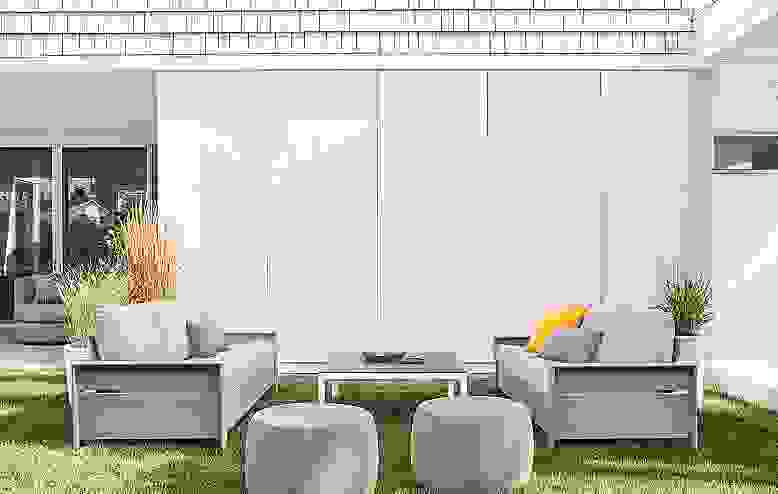 Detail of two Rayo sofas in Mist grey fabric in lawn.