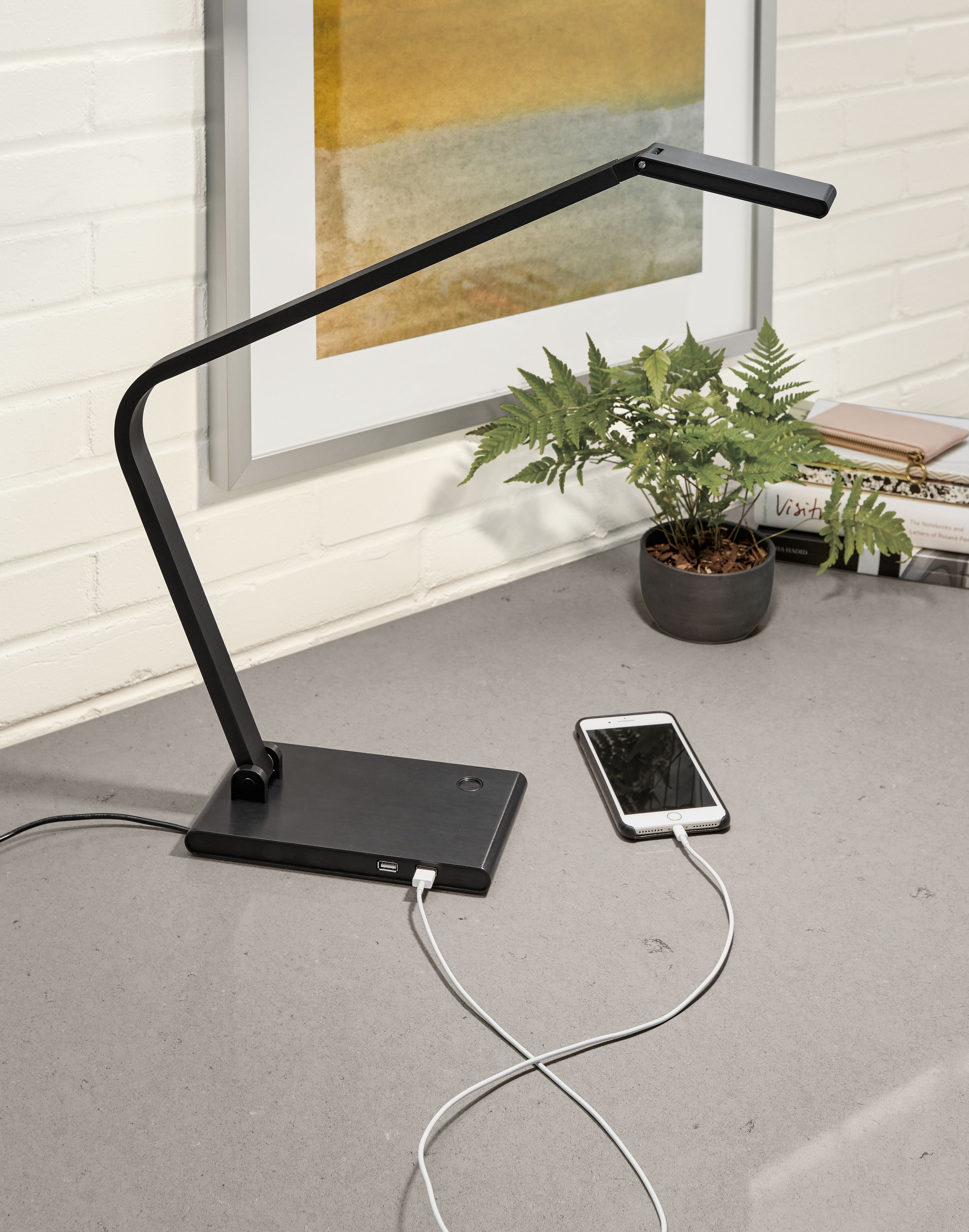 Detail of Reach table lamp in anodized black.