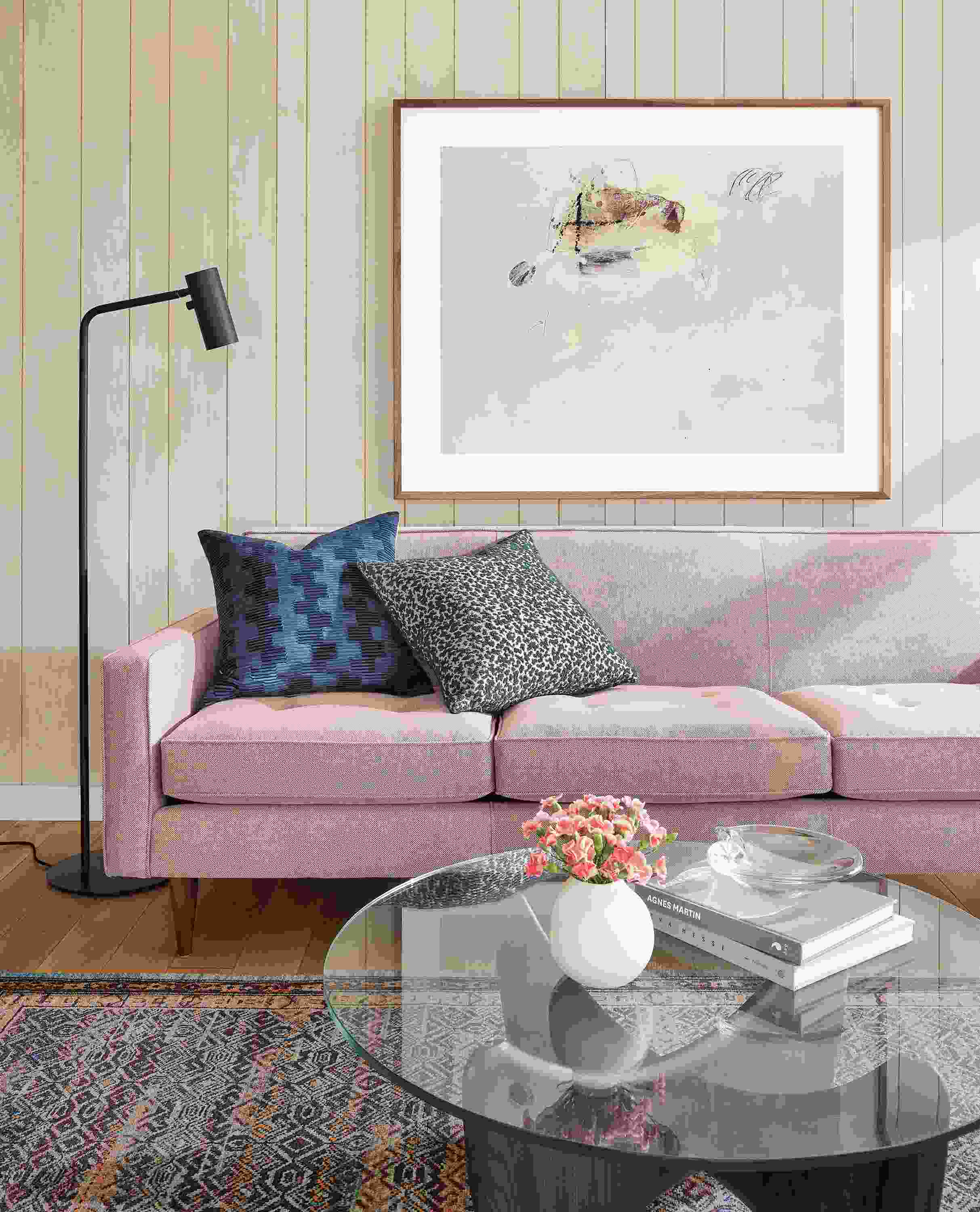 Living room with Reese sofa in Gino Paprika and Sanders coffee table in charcoal with clear glass top.