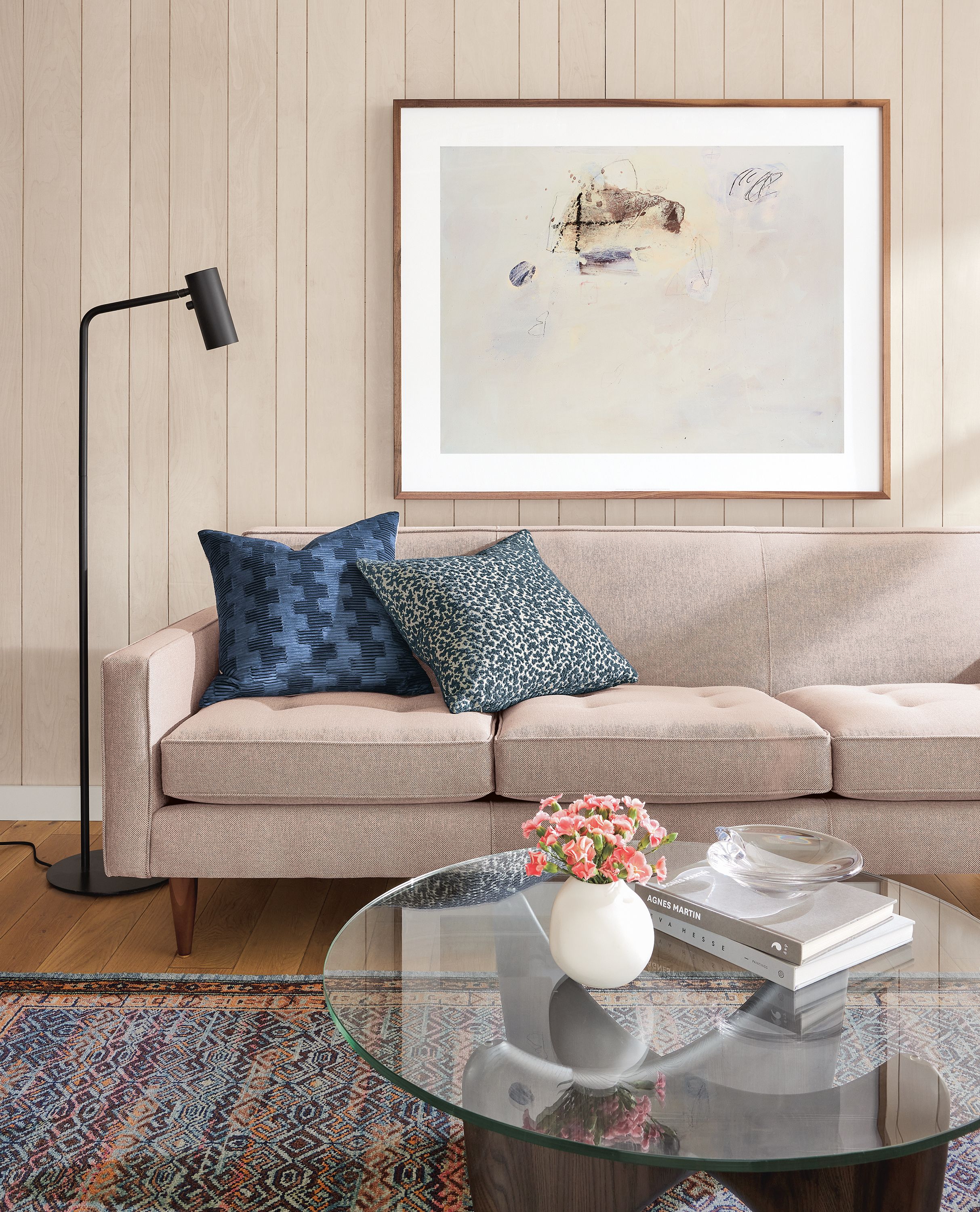 Living room with Reese sofa in Gino Paprika and Sander coffee table in charcoal with clear glass top.