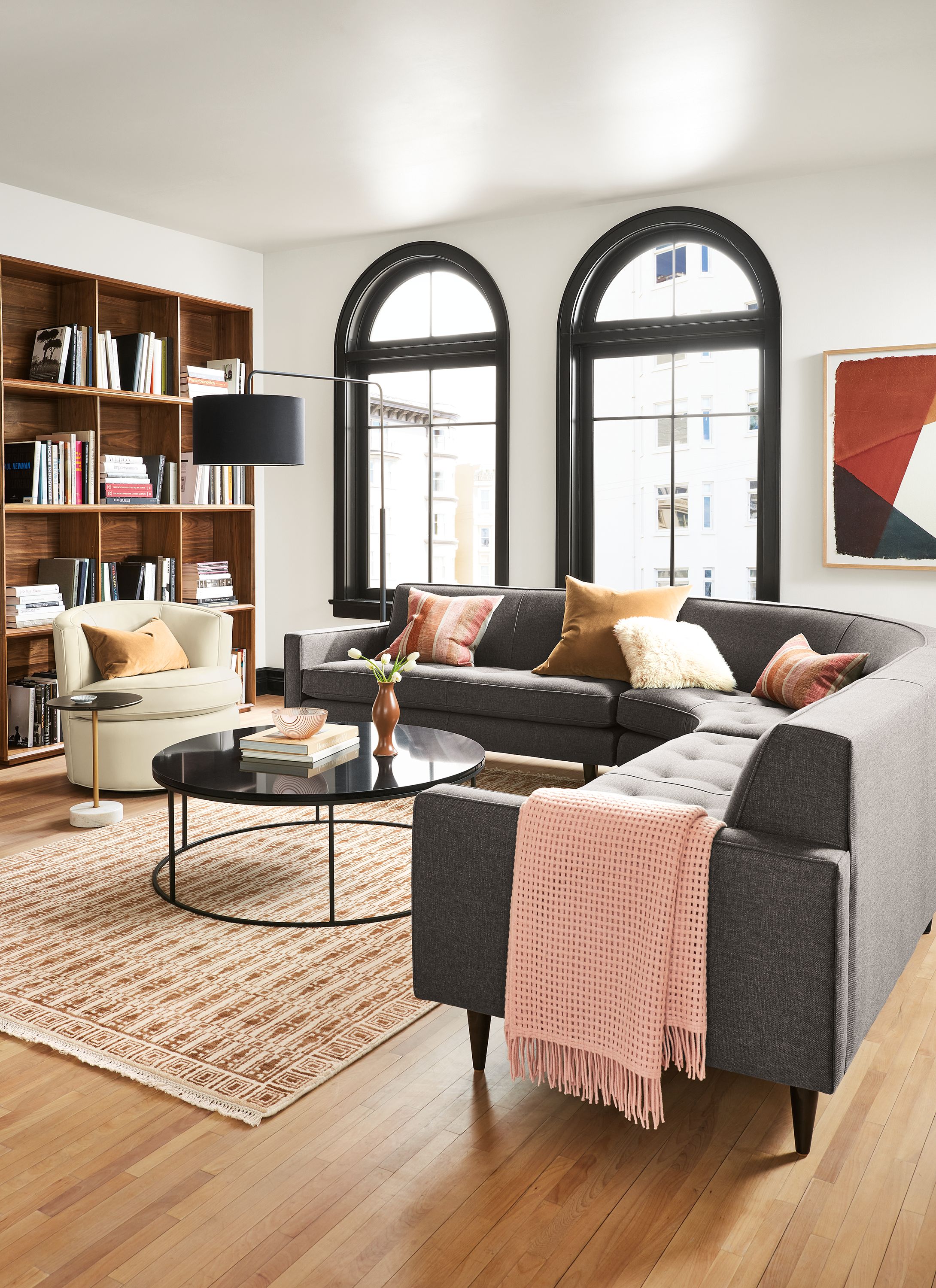 living room with curved reese sectional in gino charcoal fabric.