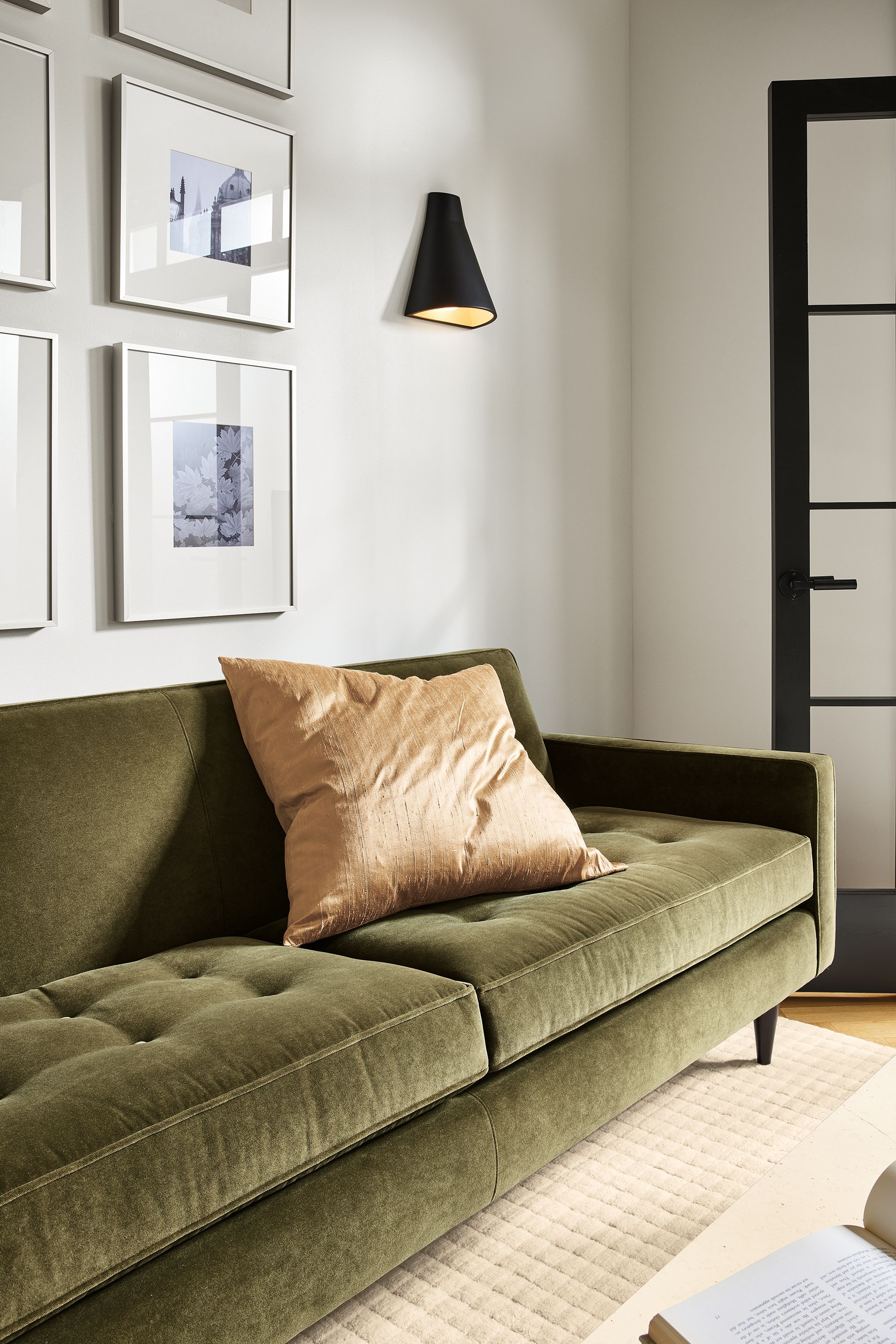 living room with reese sofa in banks fir velvet, with velvet pillow.