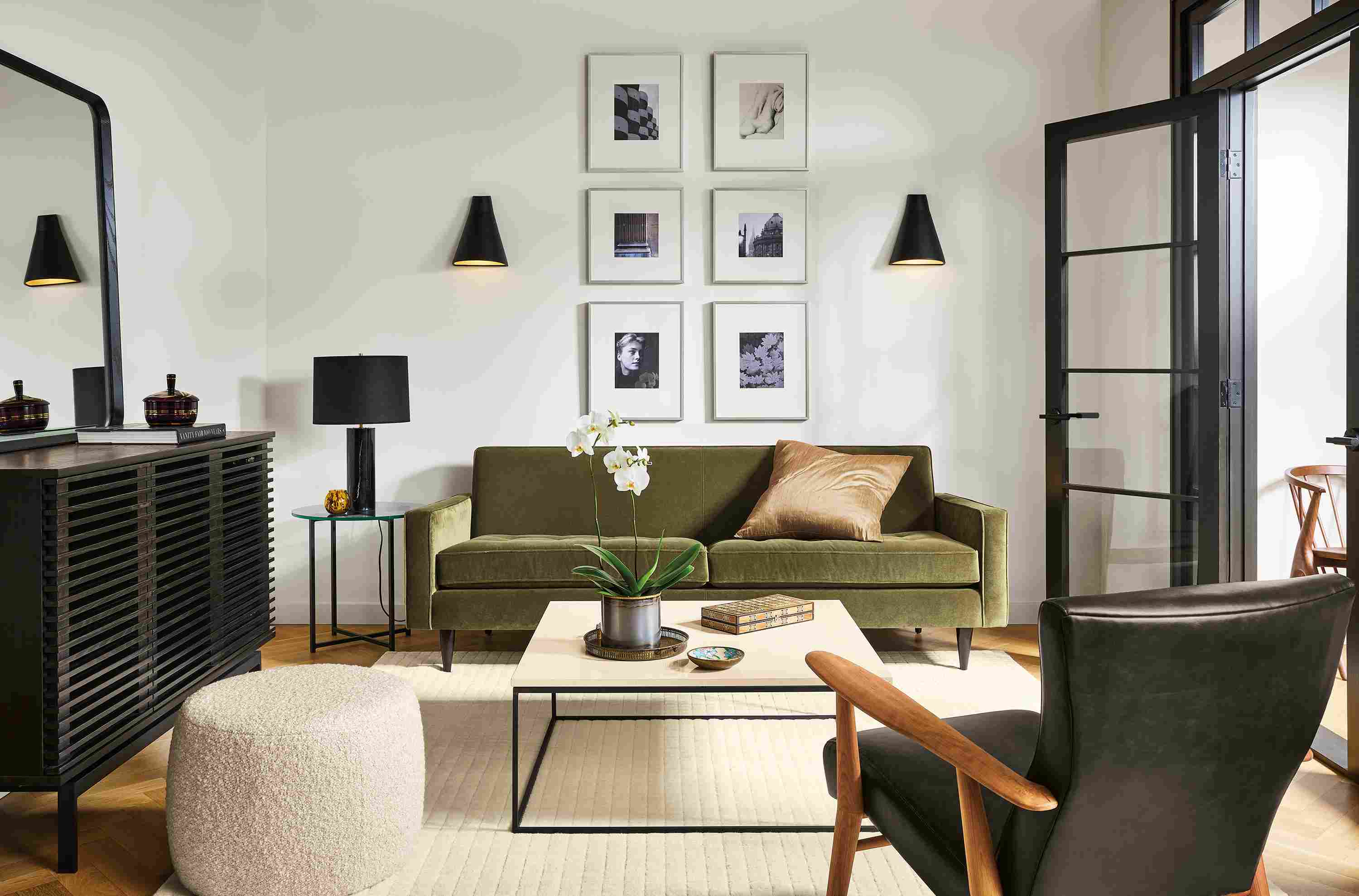 Living room with Reese sofa in Banks Fir fabric, Jonas chair in Palermo Charcoal, Tyne coffee table and Coles storage cabinet.