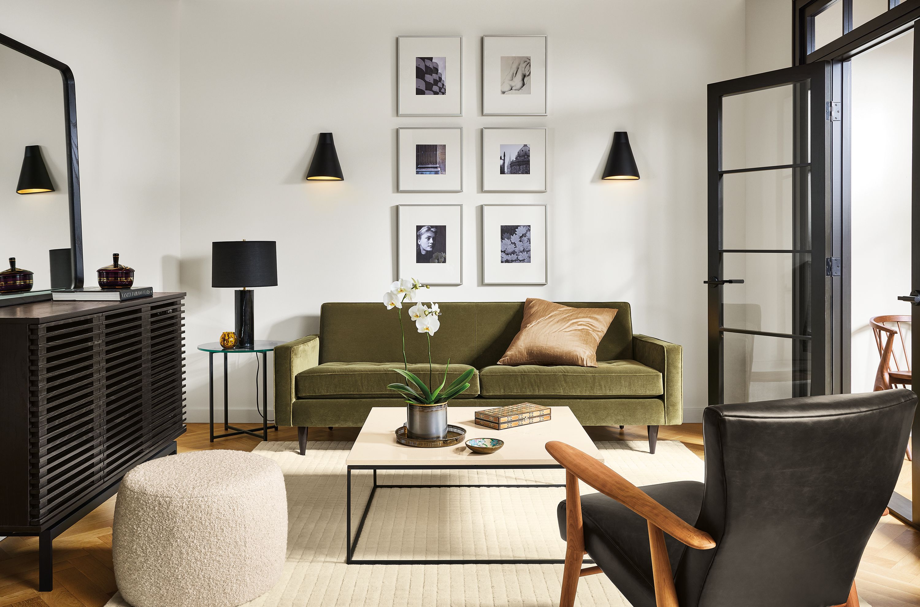 living room with reese sofa in banks fir fabric, jonas chair in leather, tyne coffee table and coles storage cabinet.