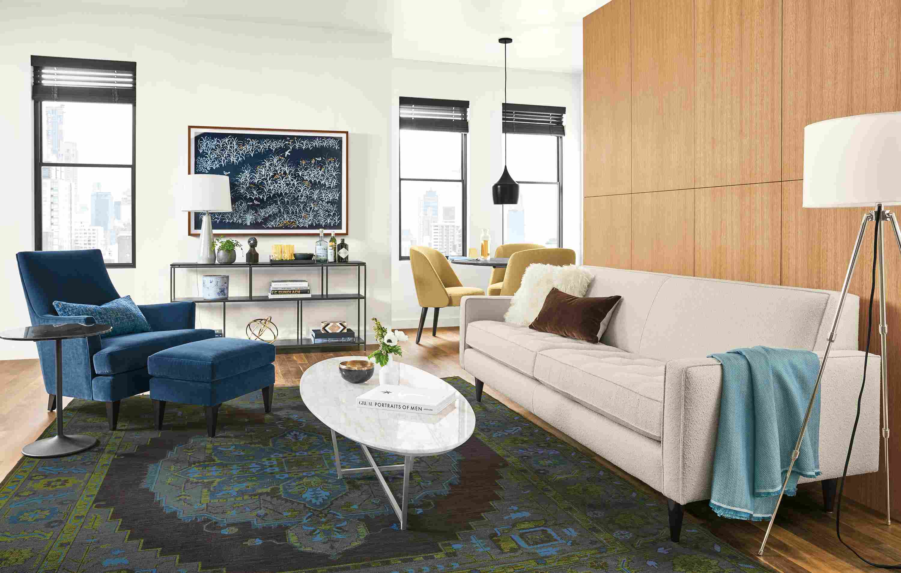 Living room with Reese 85-inch sofa in Declan Ivory and Nadine chair and ottoman in Banks Denim.
