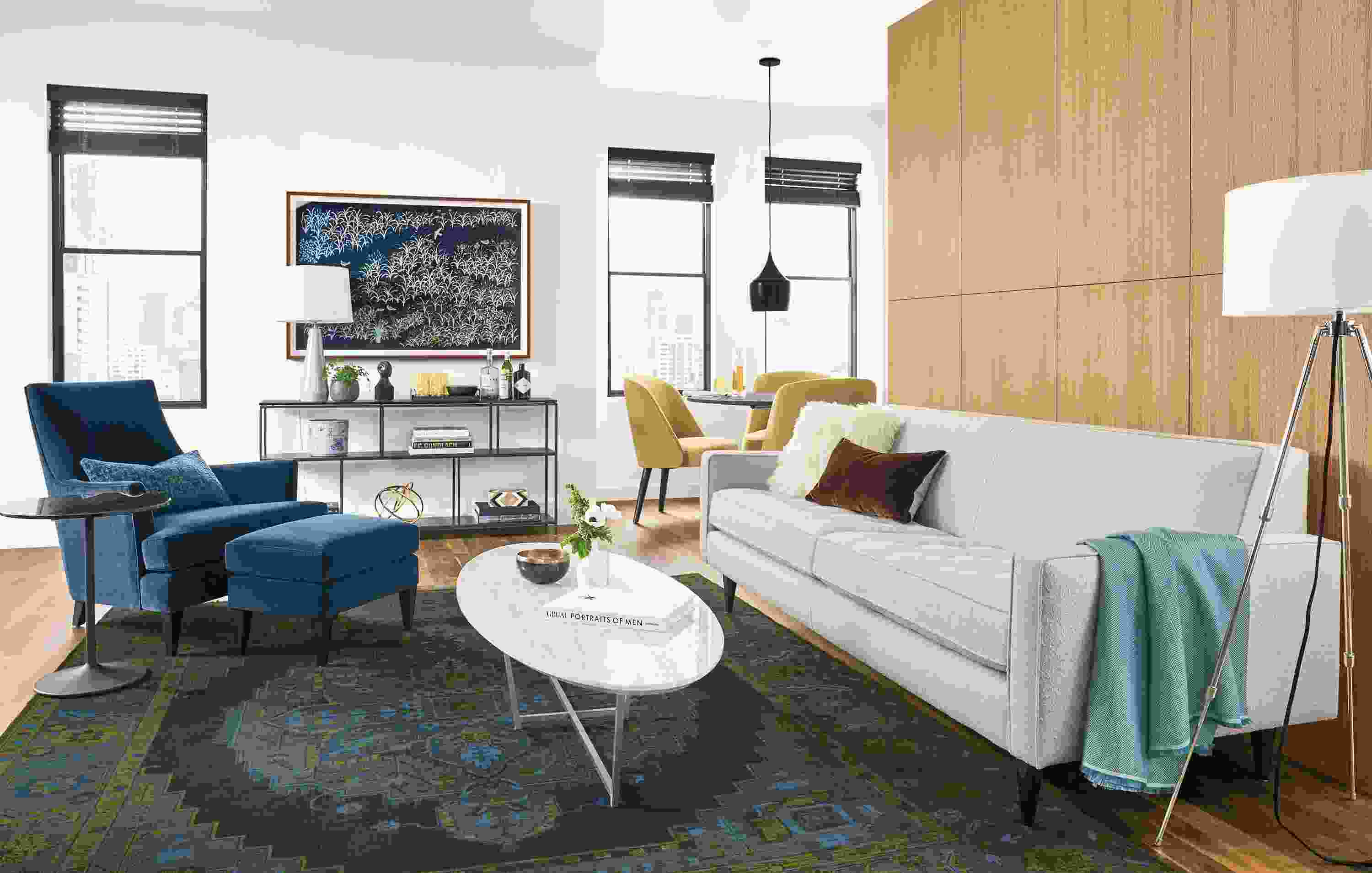 Living room with Reese 85-inch sofa in Declan Ivory and Nadine chair and ottoman in Banks Denim.