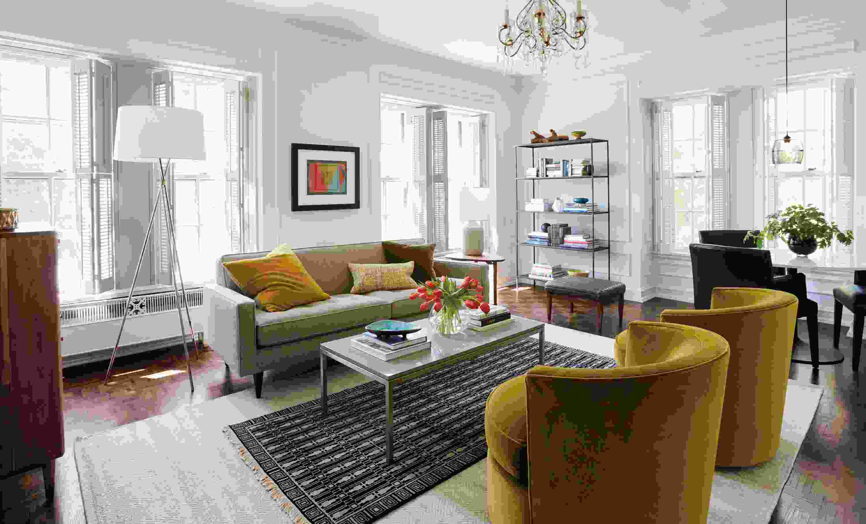 Living room with Reese sofa in Tatum Grey, 2 Otis swivel chairs in Vance Mustard and Tulum rug in Ebony.