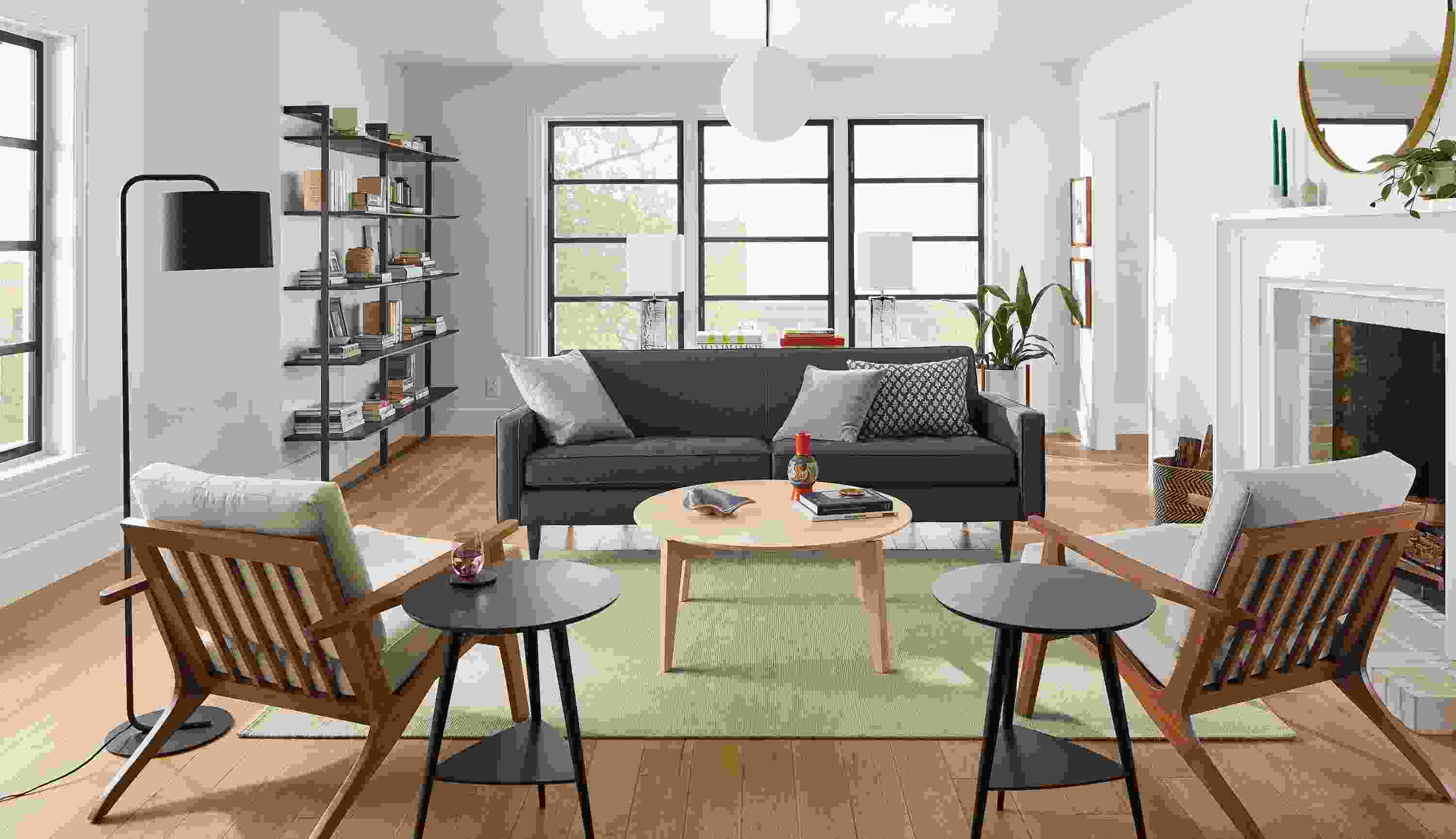 Living room featuring Reese sofa in Gino Charcoal fabric and 2 Sanna chairs with walnut base and Gino Oatmeal cushions.