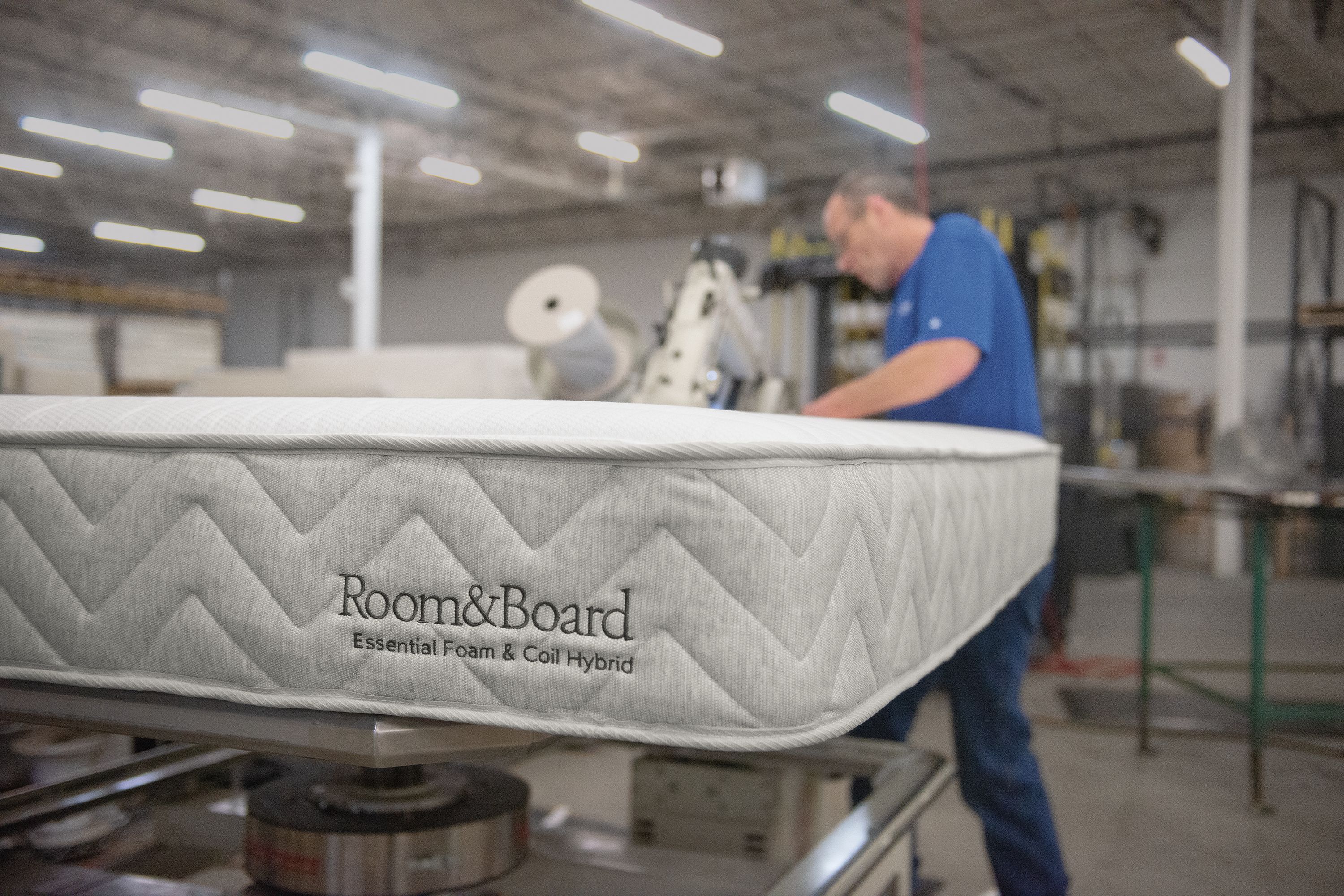 Detail of a completed mattress showing Room & Board logo in the Restwell mattress facility.
