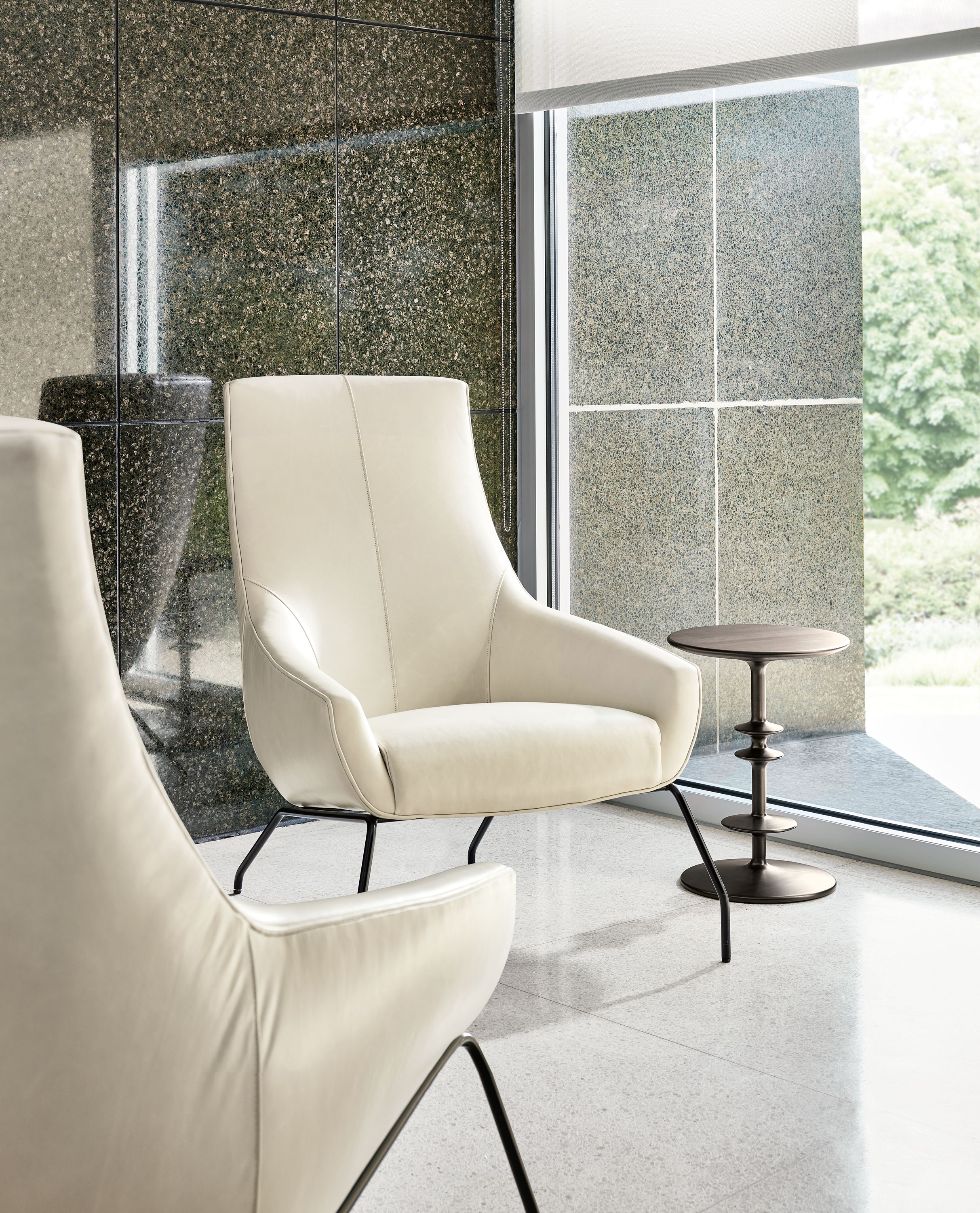 Rhodes lounge chair in Vento vory with parks end table in charcoal on cherry.