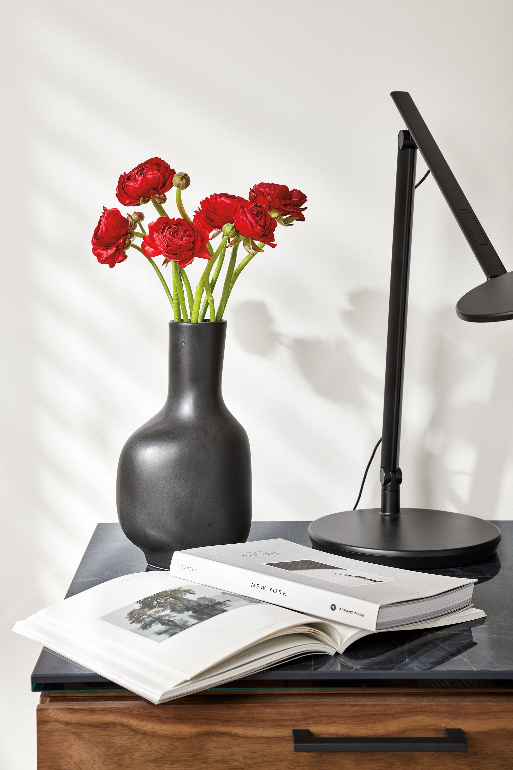 detail of ripple vase in black on nightstand.