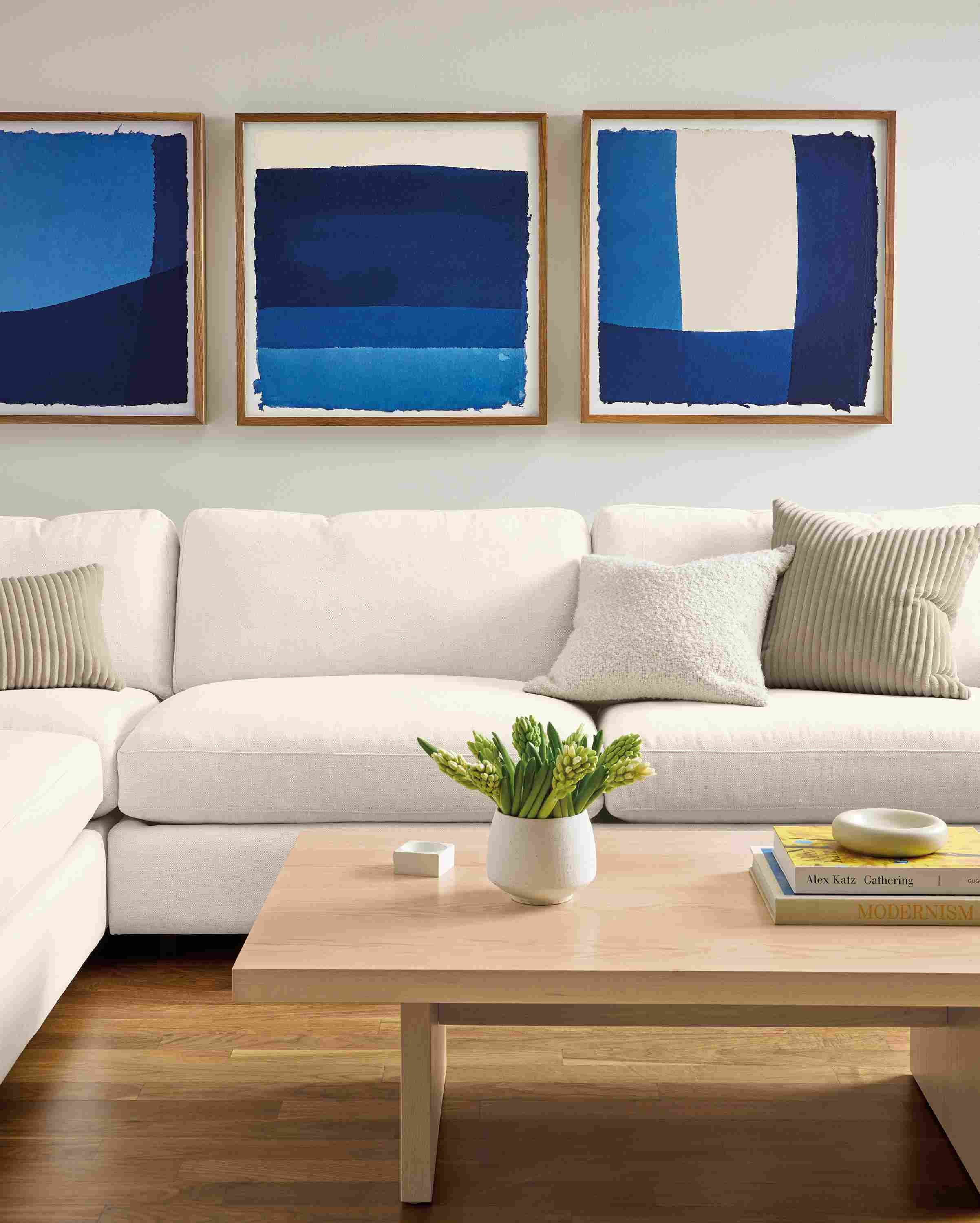 Living room with 3 wall art pieces by John Robshaw, Dip Dye #1,#2 and #3 in indigo.