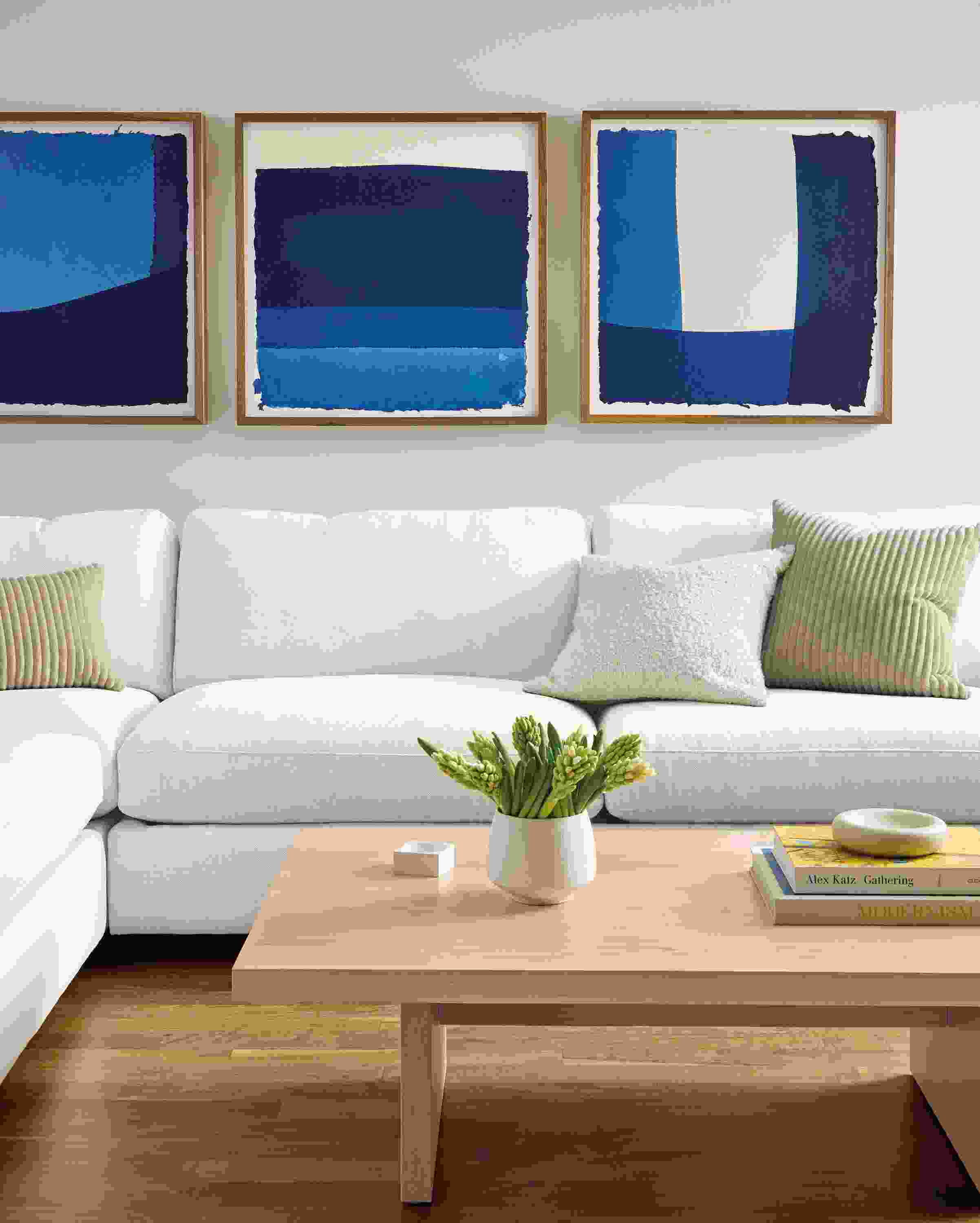 Living room with 3 wall art pieces by John Robshaw, Dip Dye #1,#2 and #3 in indigo.