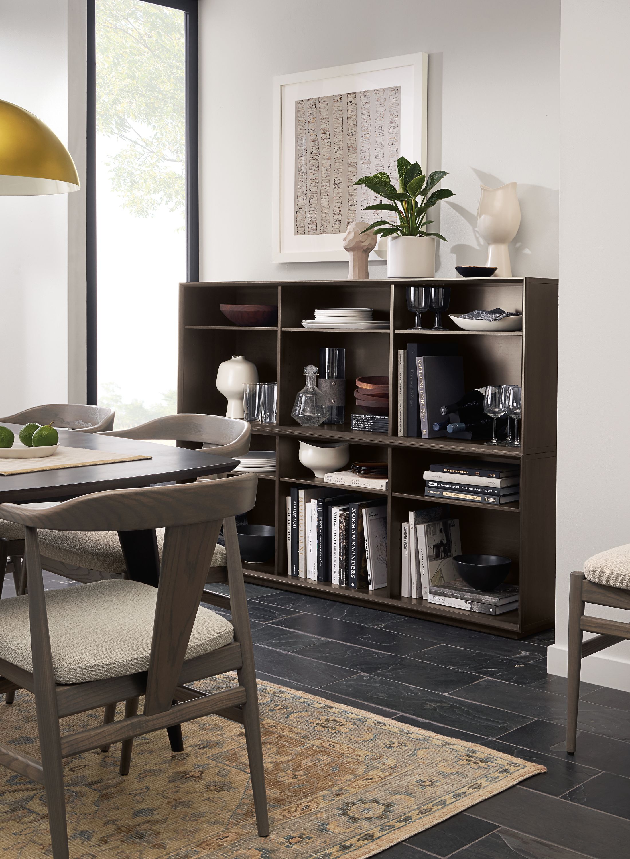 Dining room with Rollins stacking cubes in charcoal on maple and Veda rug in camel.
