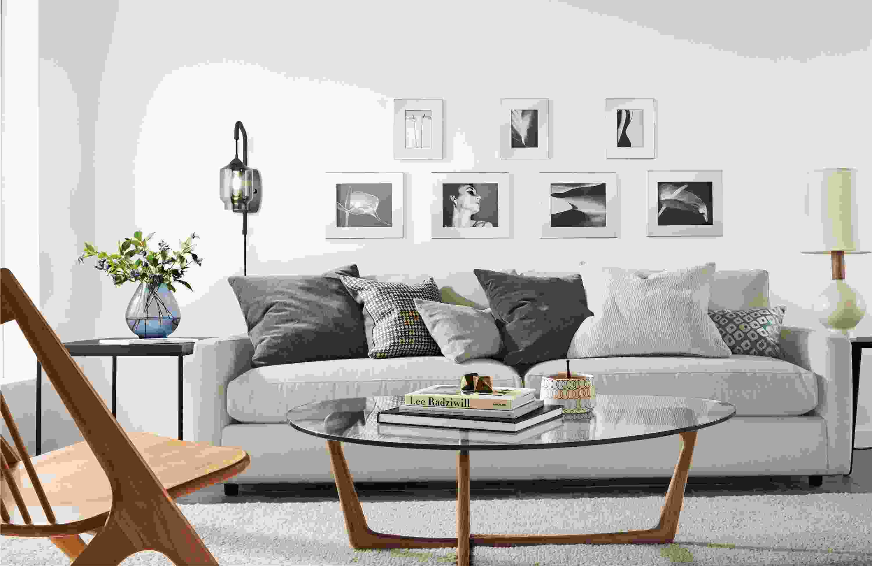 Living room with a group of pillows arranged on a Linger sofa in Dawson Bone.