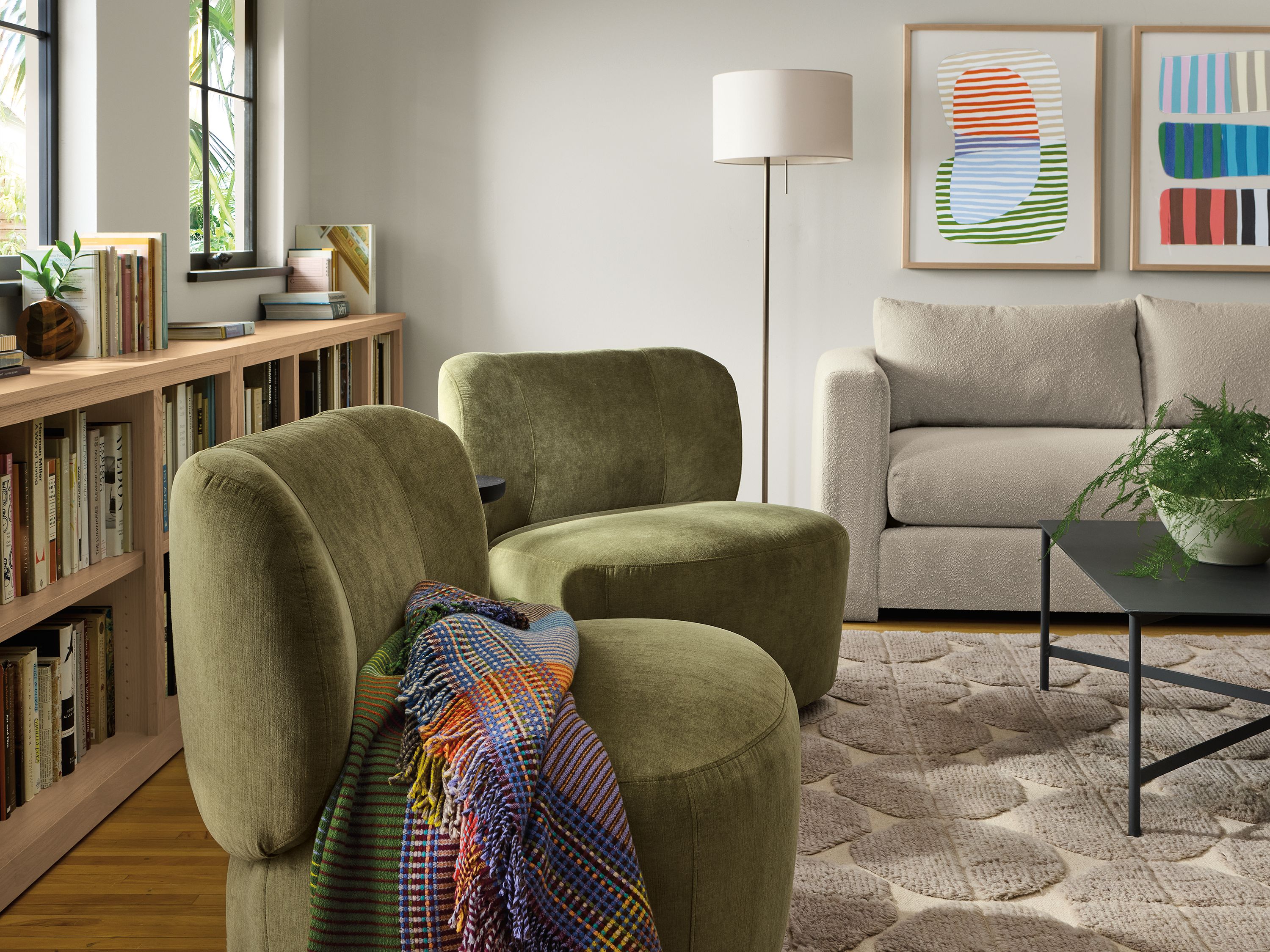 2 Rory swivel chairs in windsor olive and a hannah bench cushion sofa in declan natural in a living room.