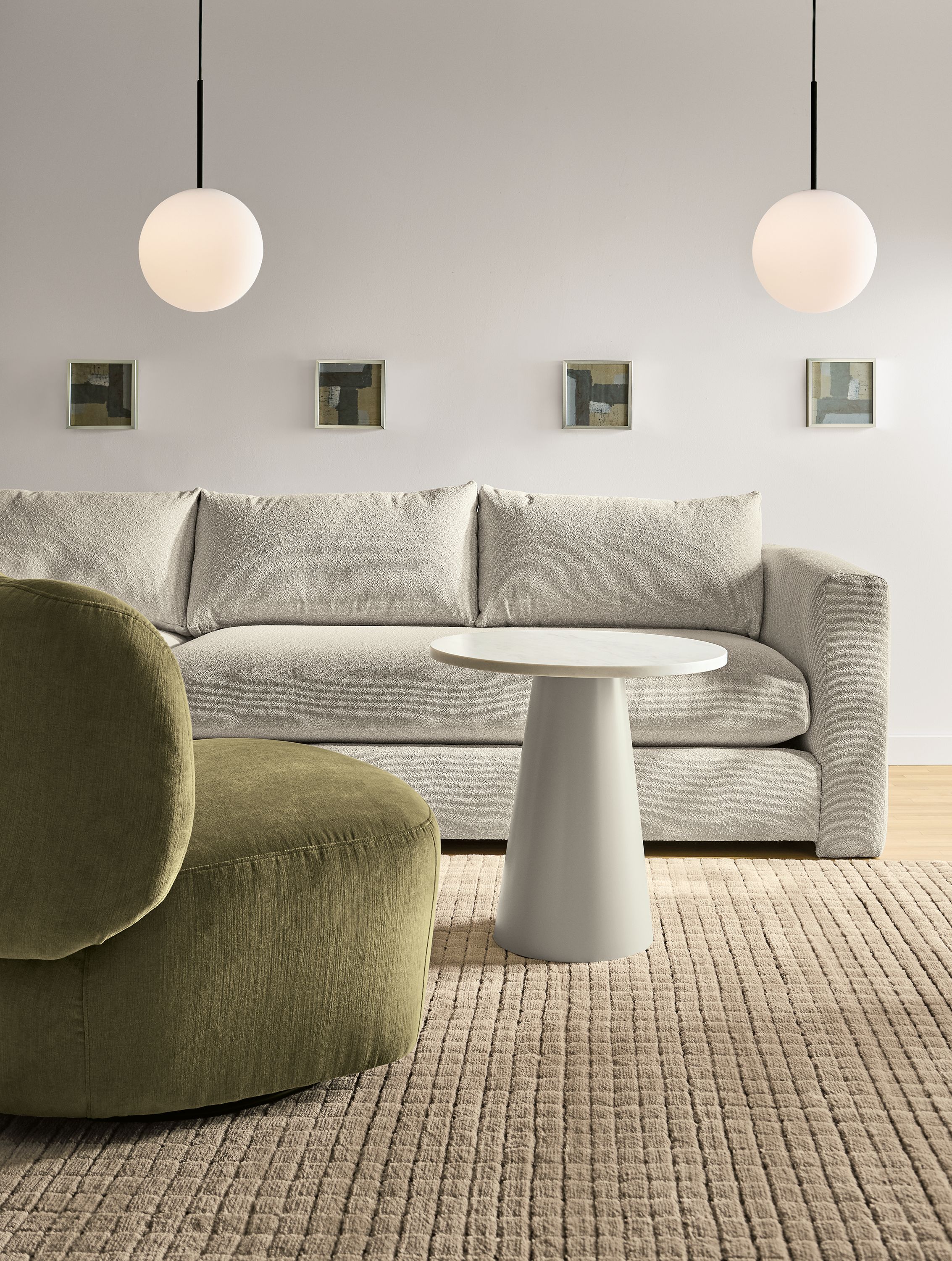 Living room with Rory swivel chair in windsor olive and 2 Hannah sofas in declan natural fabric.