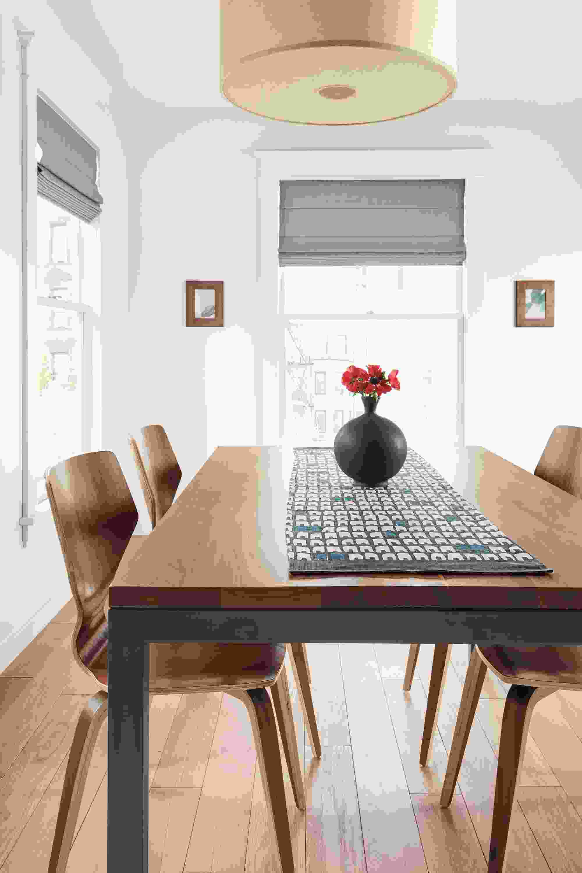 Detail of Row table runner in coal/royal and Parsons table in natural steel and walnut.