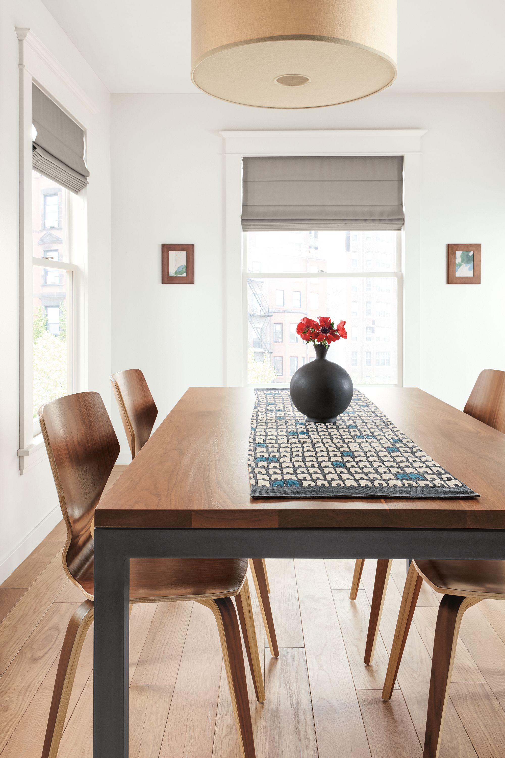 Detail of Row table runner in coal/royal and Parsons table in natural steel and walnut.
