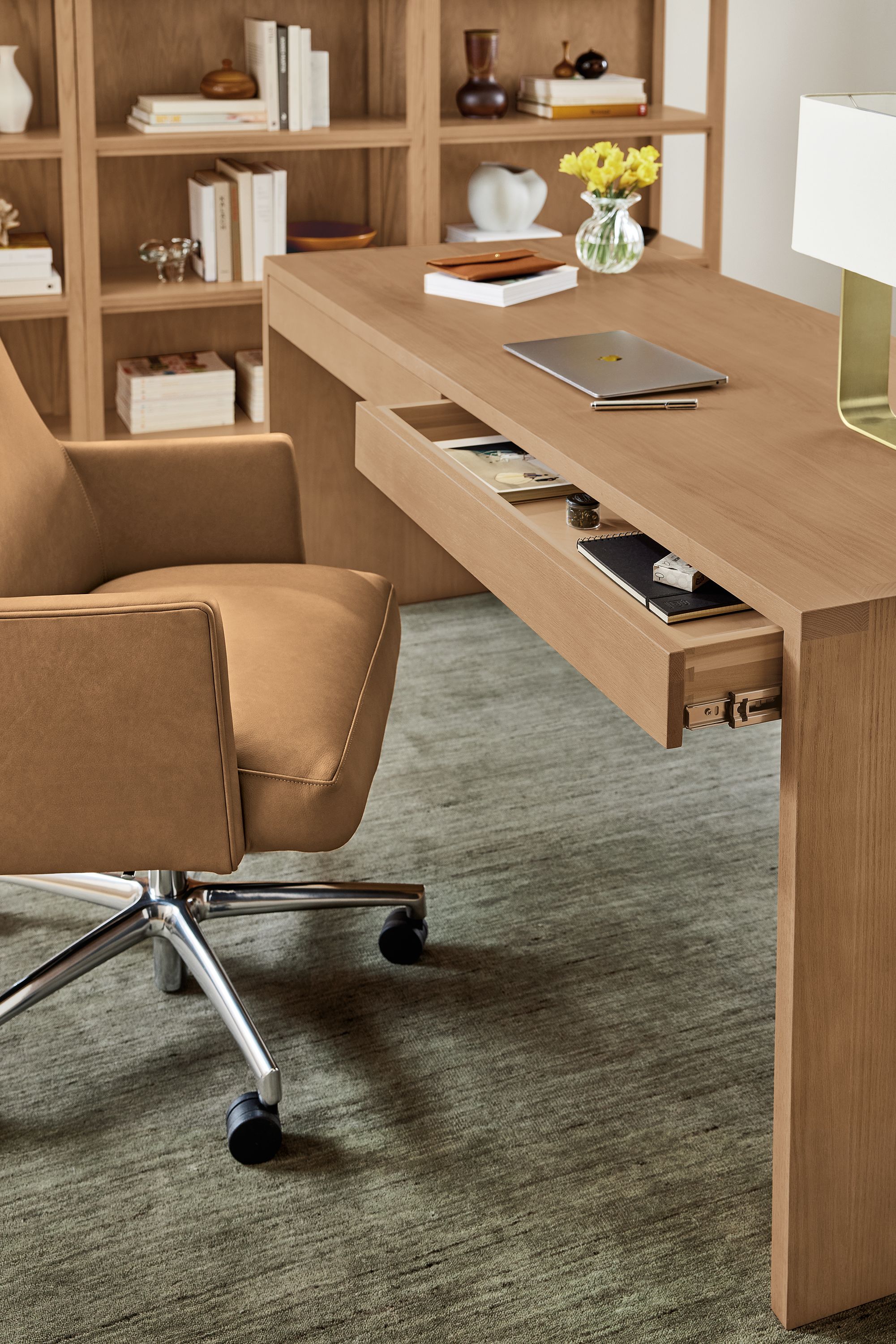 Office with detail of open drawer on Rowan 72-wide 2-drawer desk in rye on red oak and Jude office chair in Laino Camel leather.