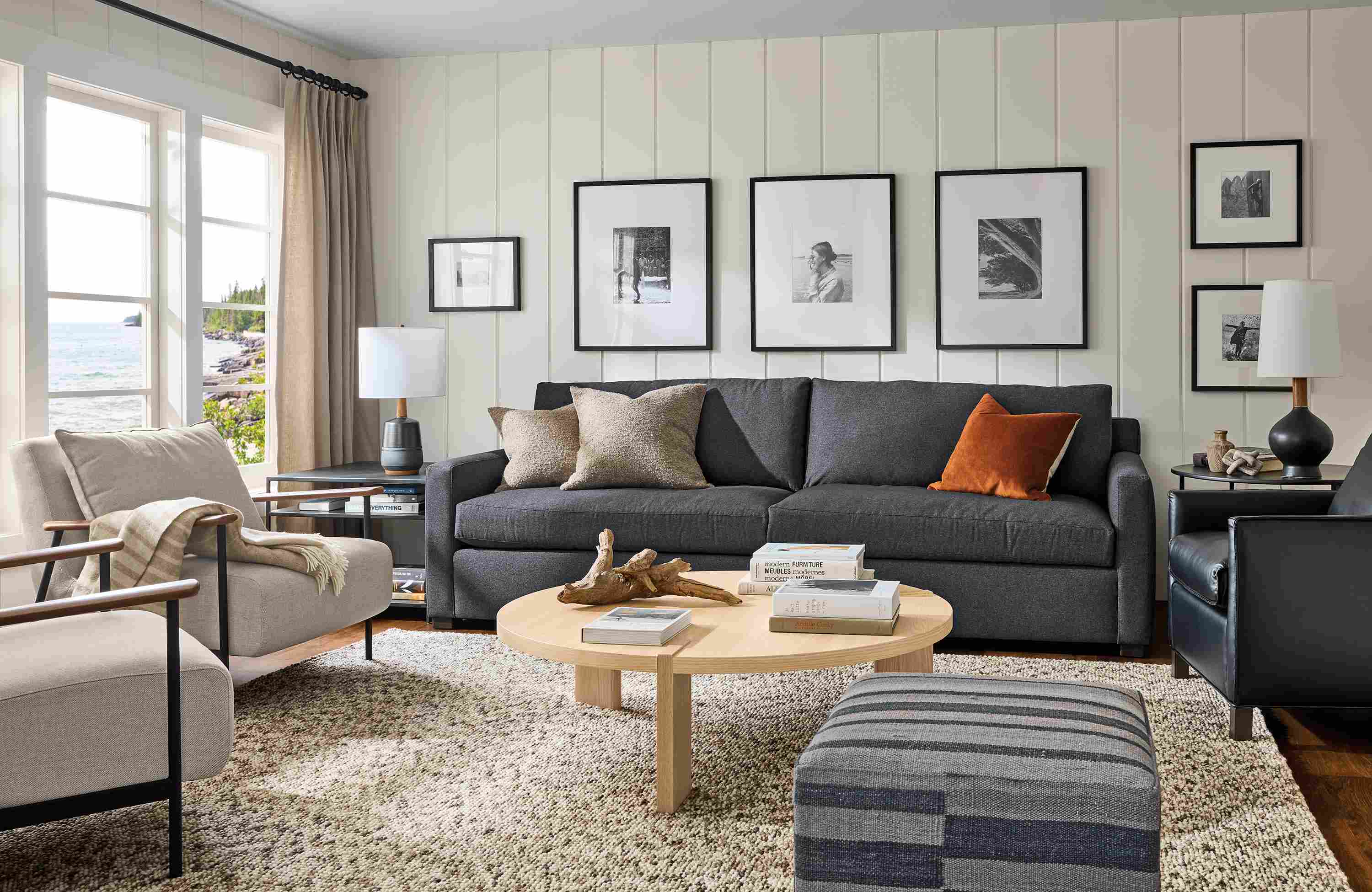 Living room with Ryan 106-wide sofa in Myers Navy, 2 Xavier chairs in Gino Oatmeal and Hanover round coffee table in salt on red oak.