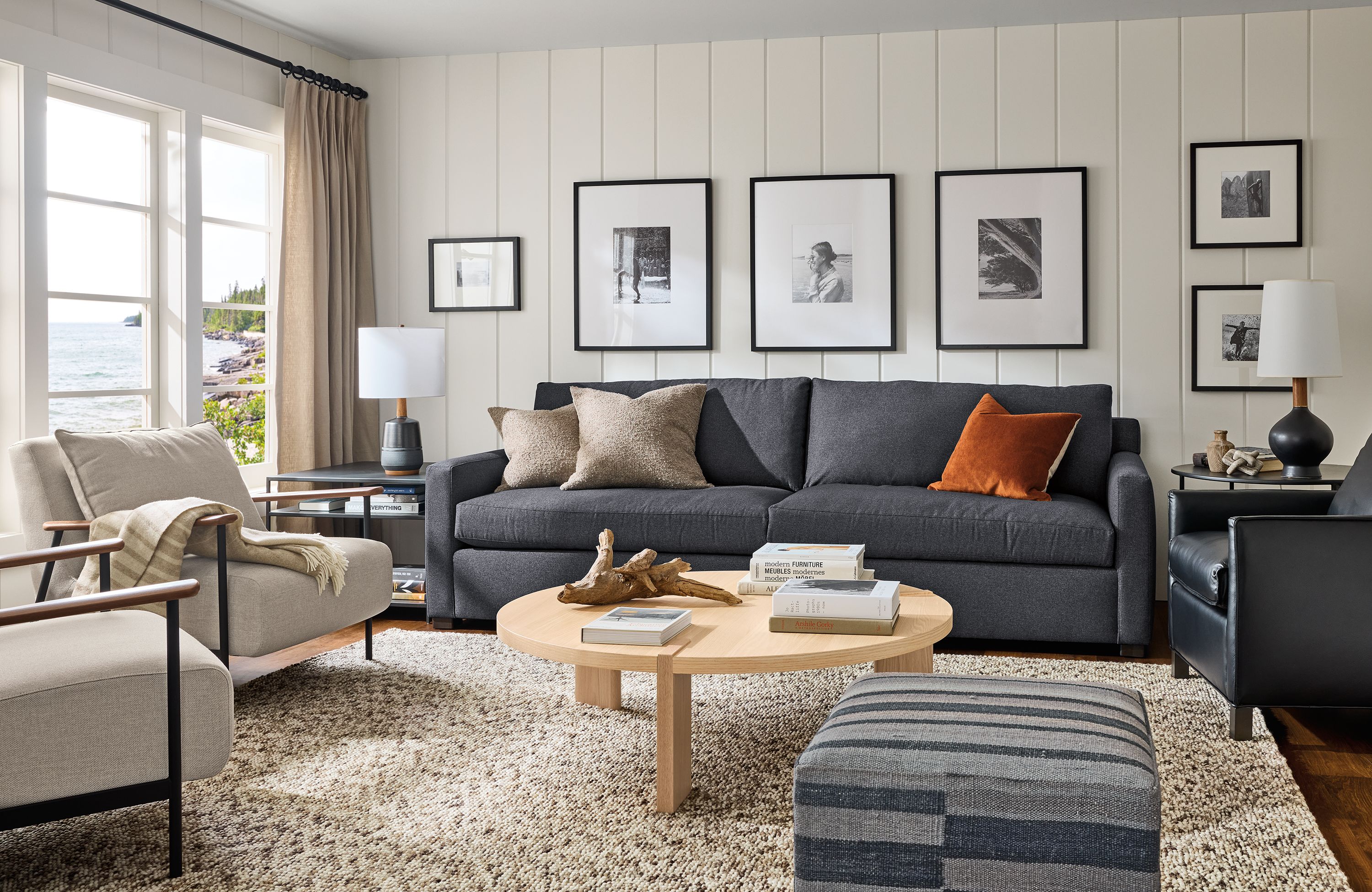 Living room with Ryan 106-wide sofa in Myers Navy, 2 Xavier chairs in Gino Oatmeal and Hanover round coffee table in salt on red oak.