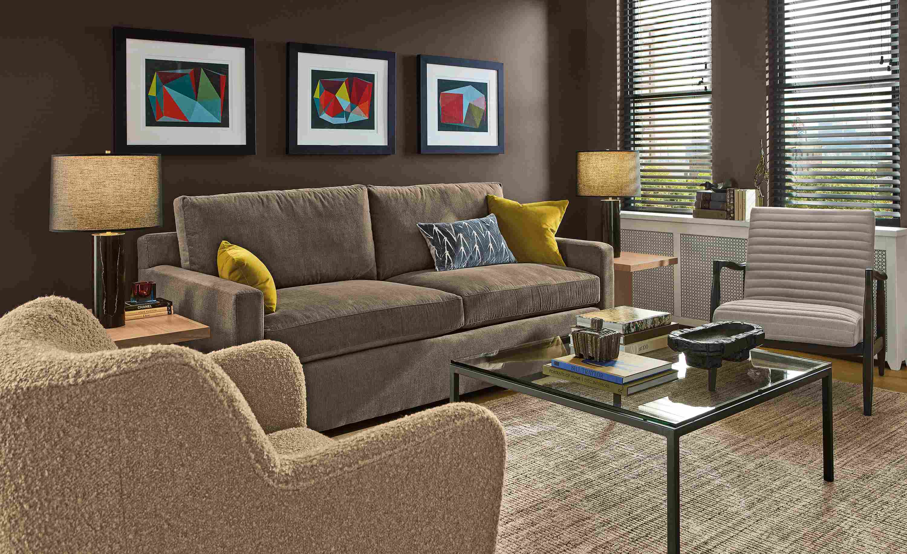 Living room with Ryan 86-wide sofa in Nigel Otter, Lily chair in Dornick Camel and Callan chair in Landen Asphalt.