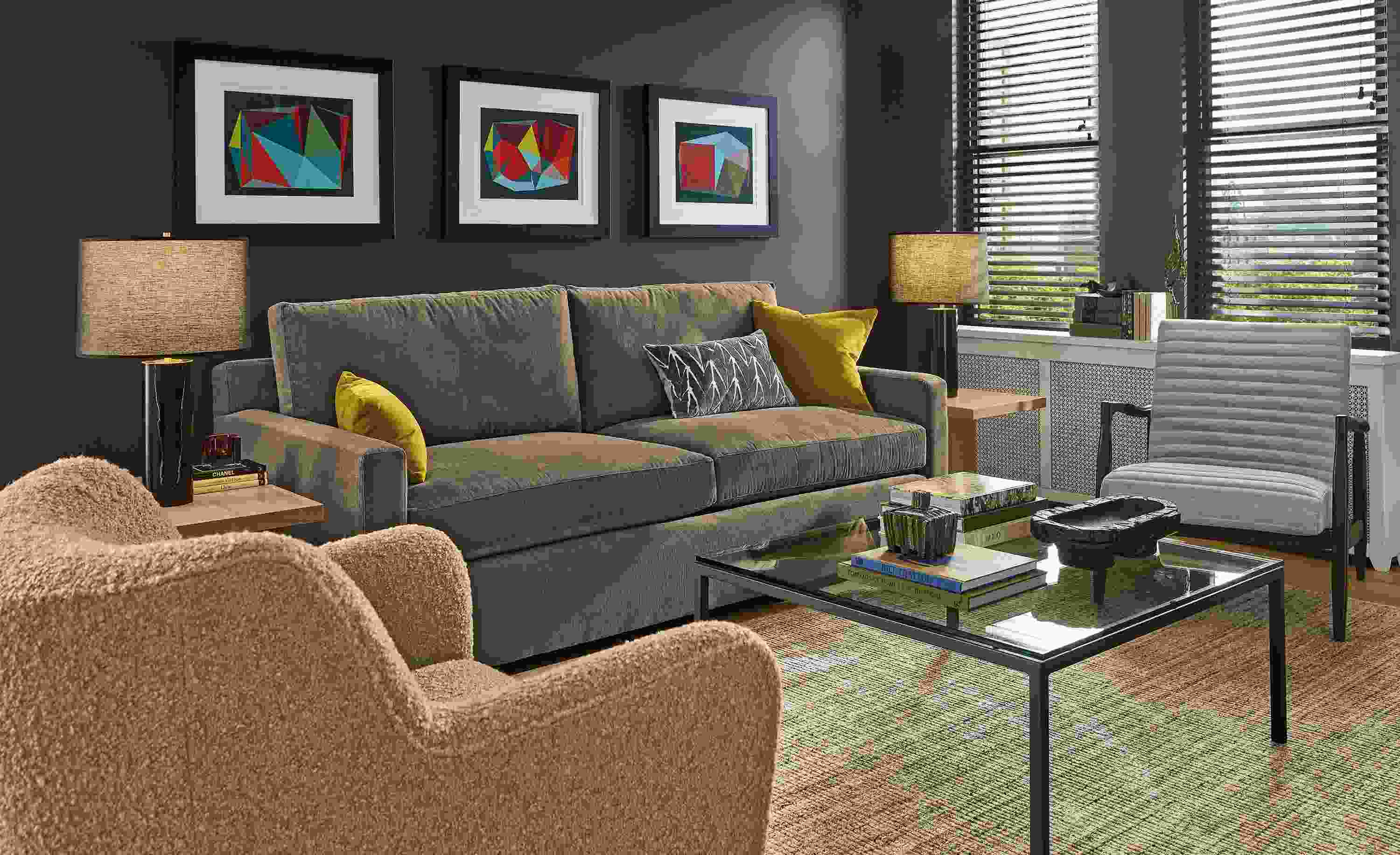 Living room with Ryan 86-wide sofa in Nigel Otter, Lily chair in Dornick Camel and Callan chair in Landen Asphalt.