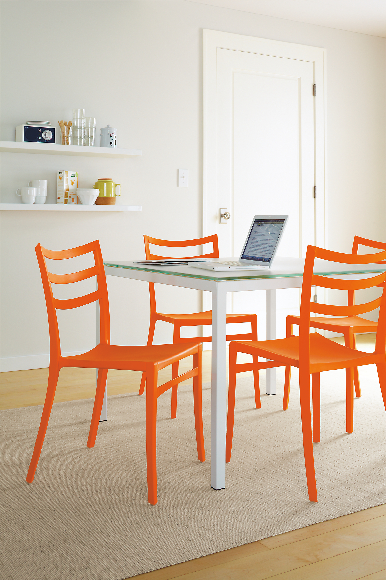 Dining room with Sabrina dining chair in orange.