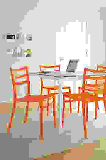 Dining room with Sabrina dining chair in orange.