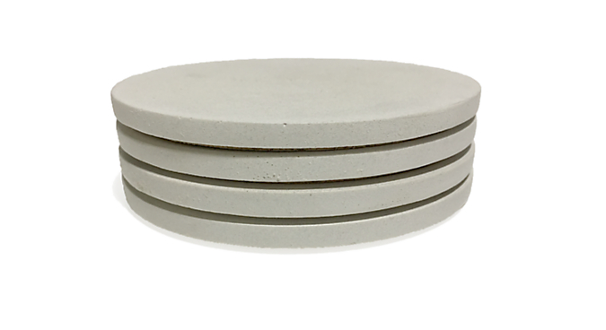 Angled view of Saco Round Coasters in White - Set of 4.