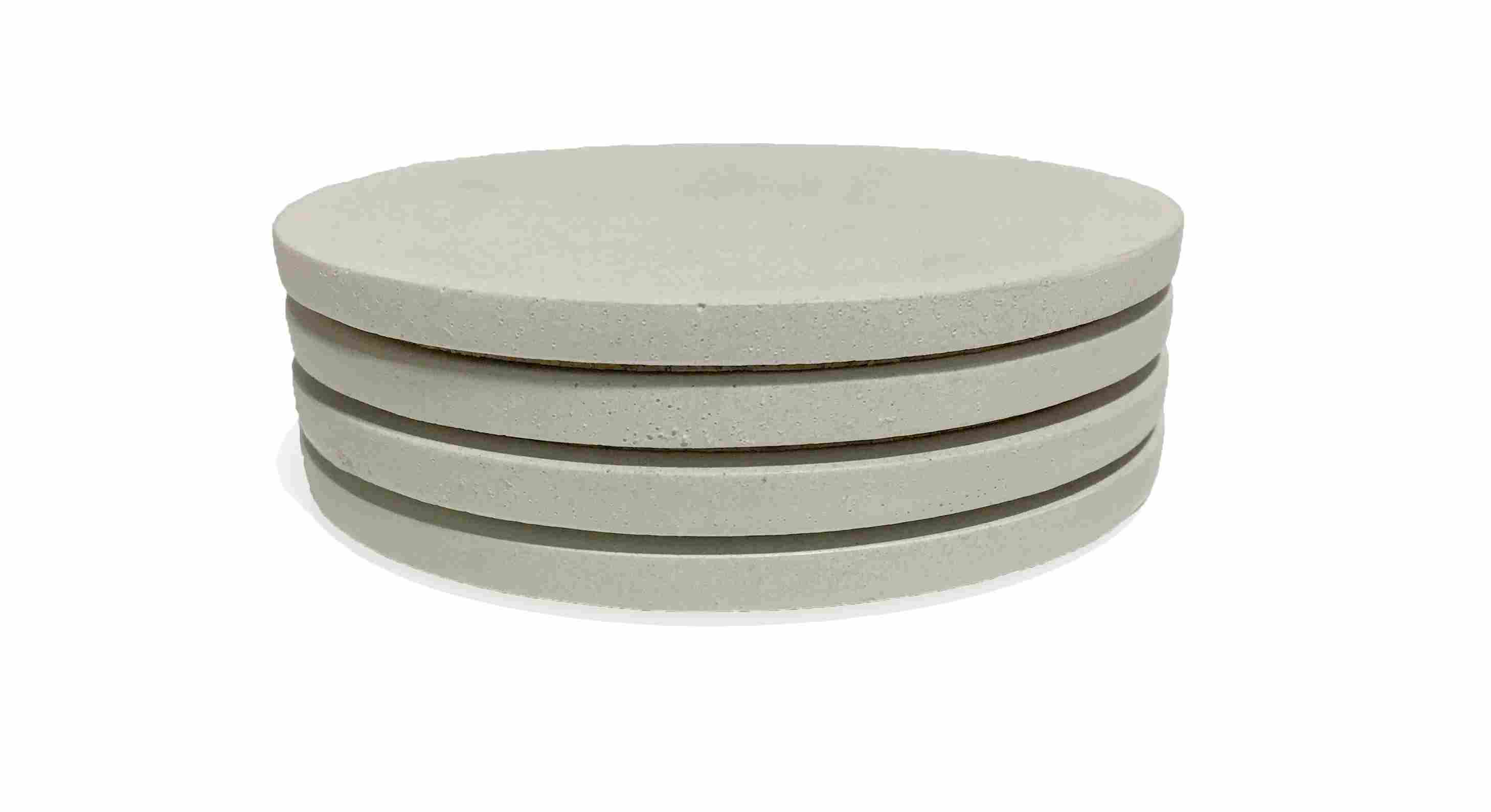 Angled view of Saco Round Coasters in White - Set of 4.