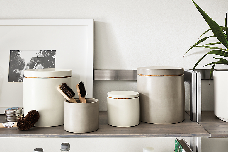 Room setting with saco canisters in white and grey with profile frame in white.