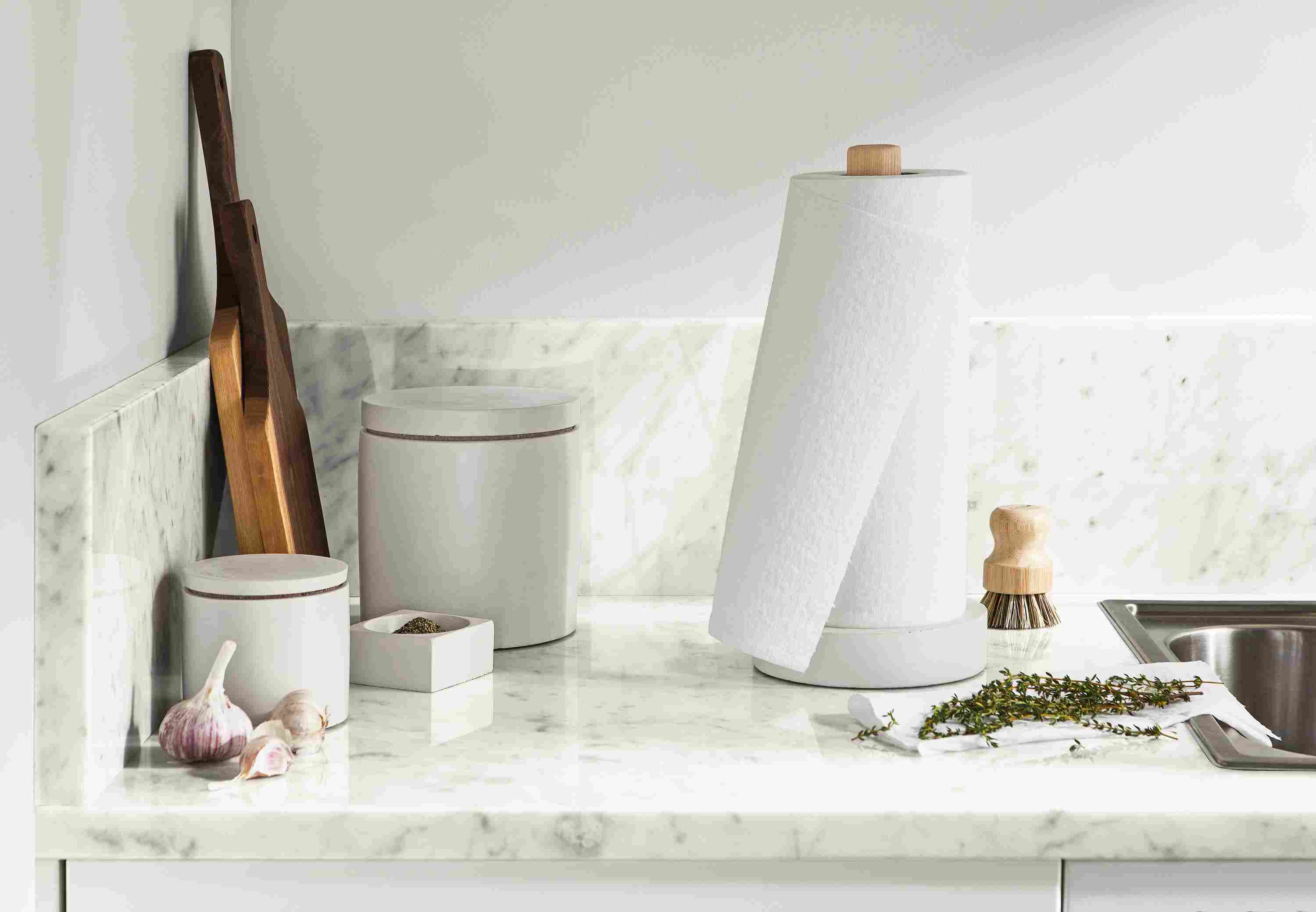 Kitchen setting with saco paper towel holder and canisters in white.