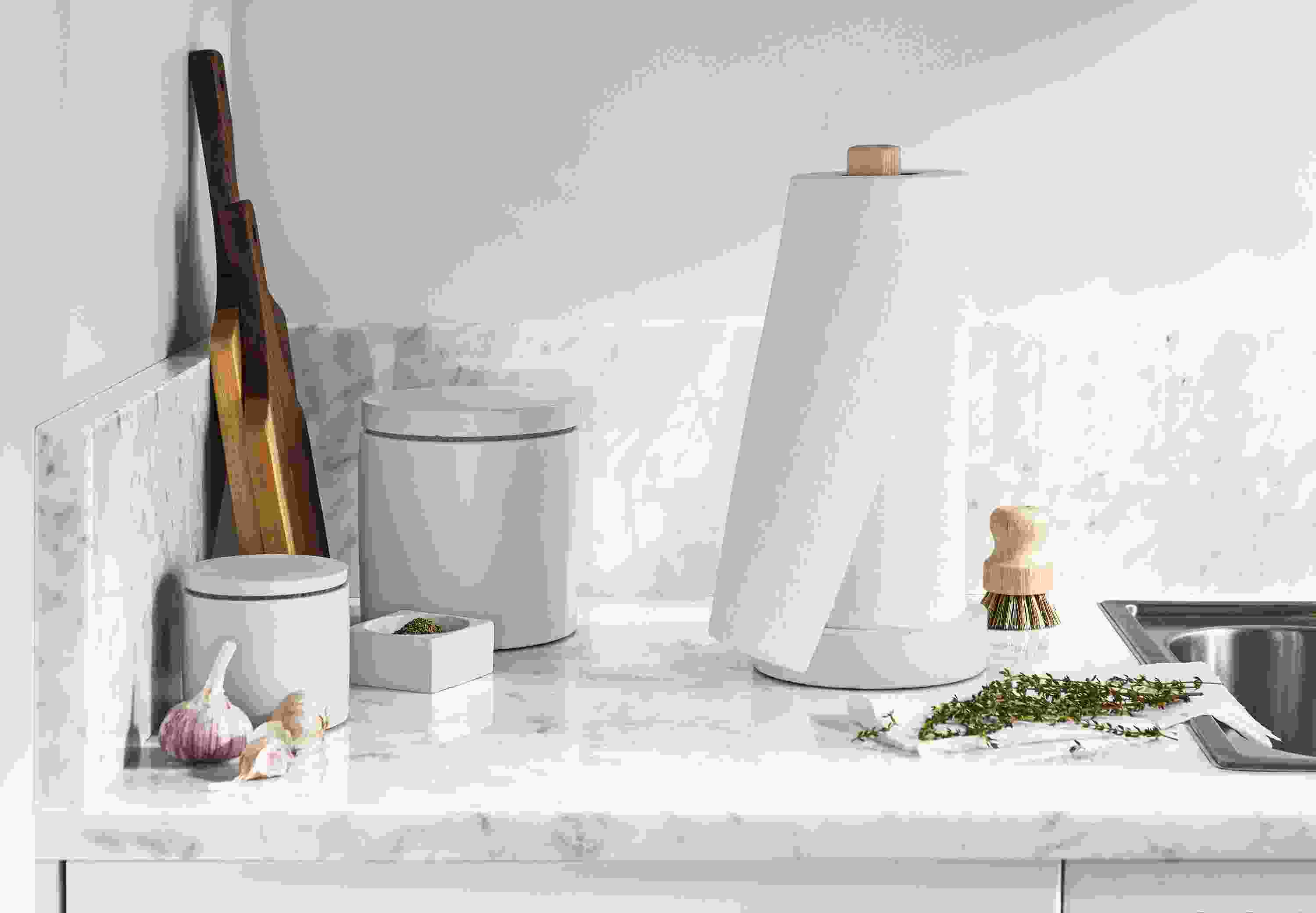 Kitchen setting with saco paper towel holder and canisters in white.