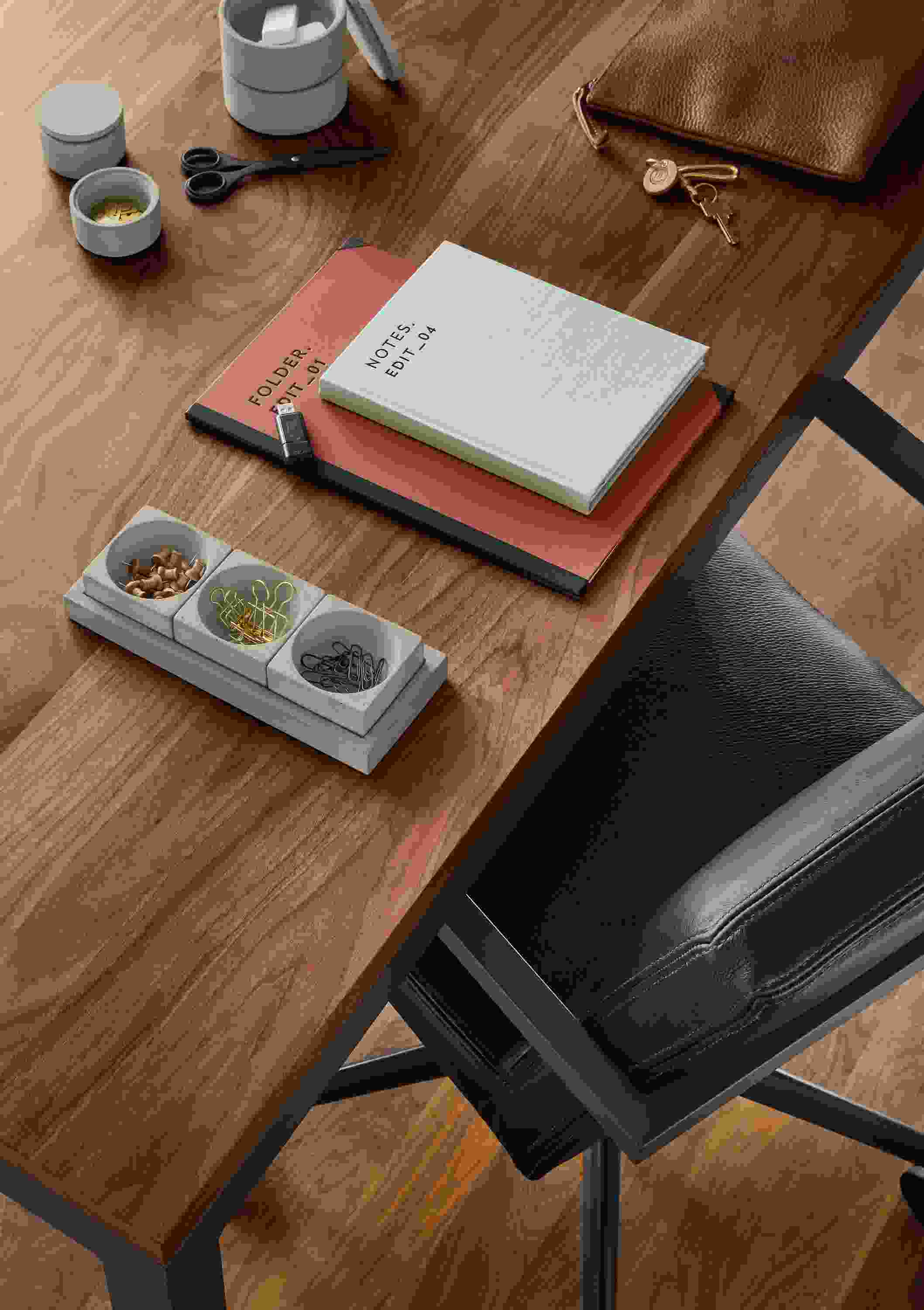 Detail of Saco pinch bowl set with tray in grey on a Parsons table in walnut.