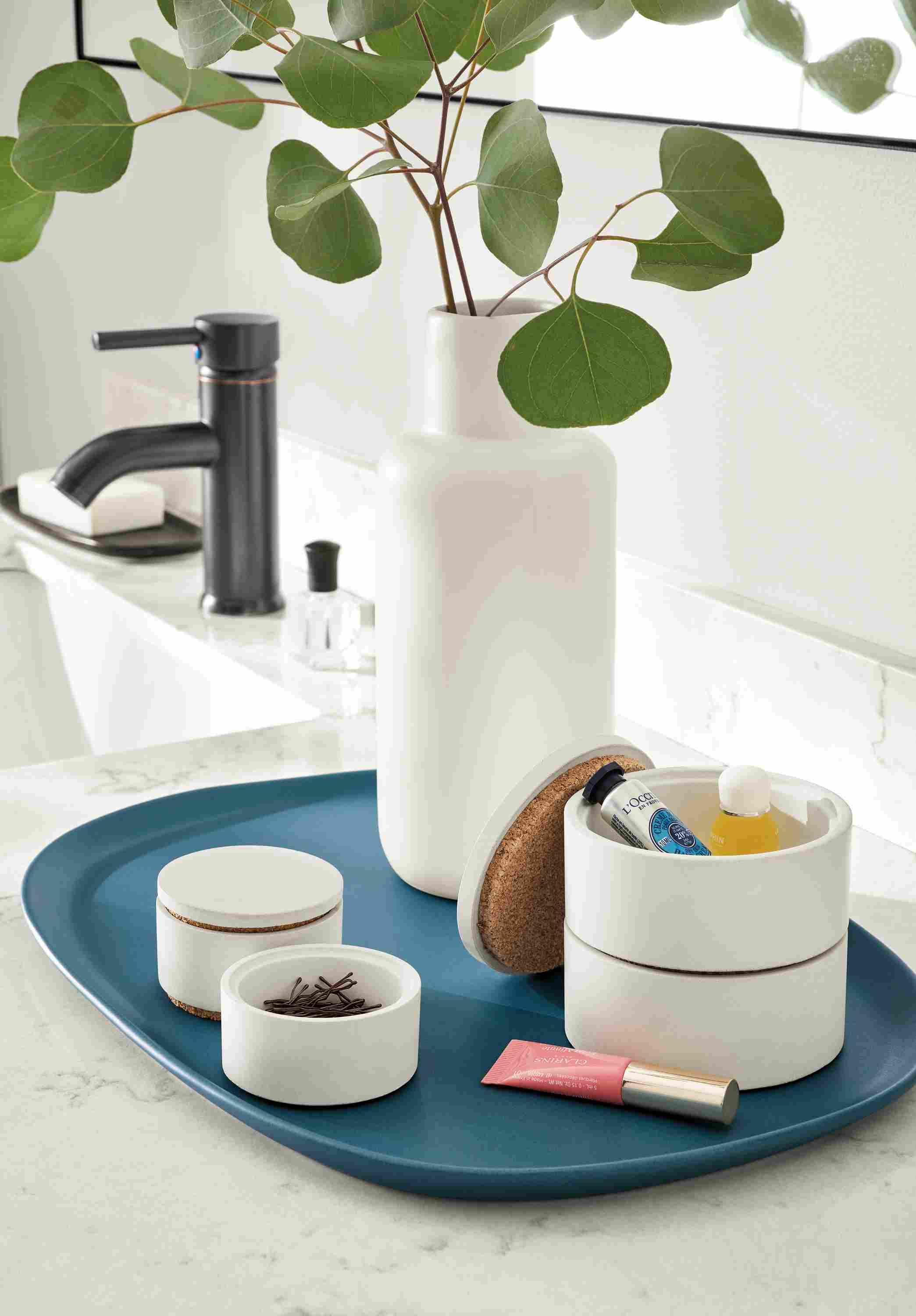 Detail of large Saco module stackers in white on a Nadi tray in denim.