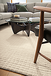 Detail of with Safira rug in ivory, jasper sectional and sanders coffee table.
