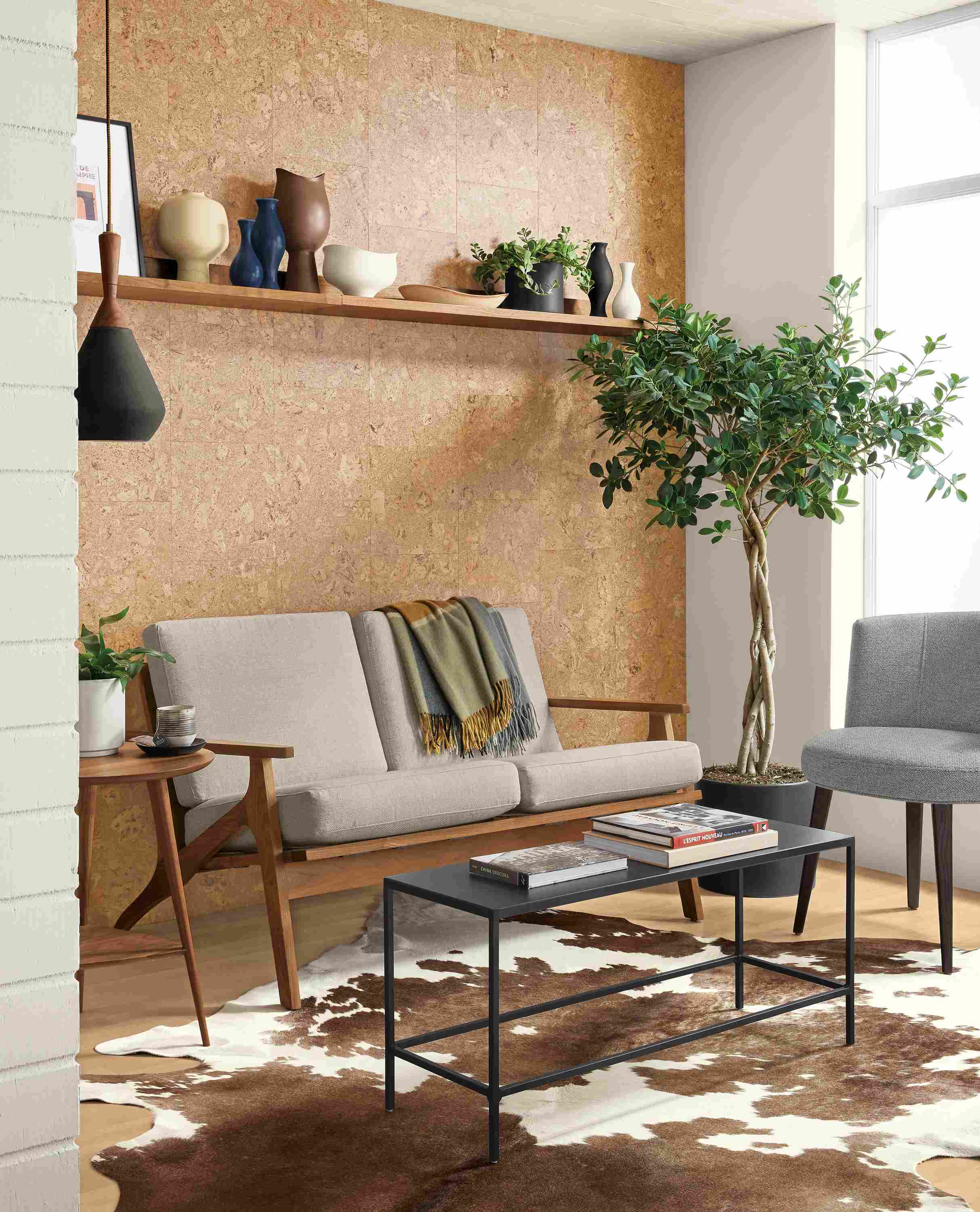 Detail of Sanna sofa in Gino Oatmeal and slim coffee table in natural steel.