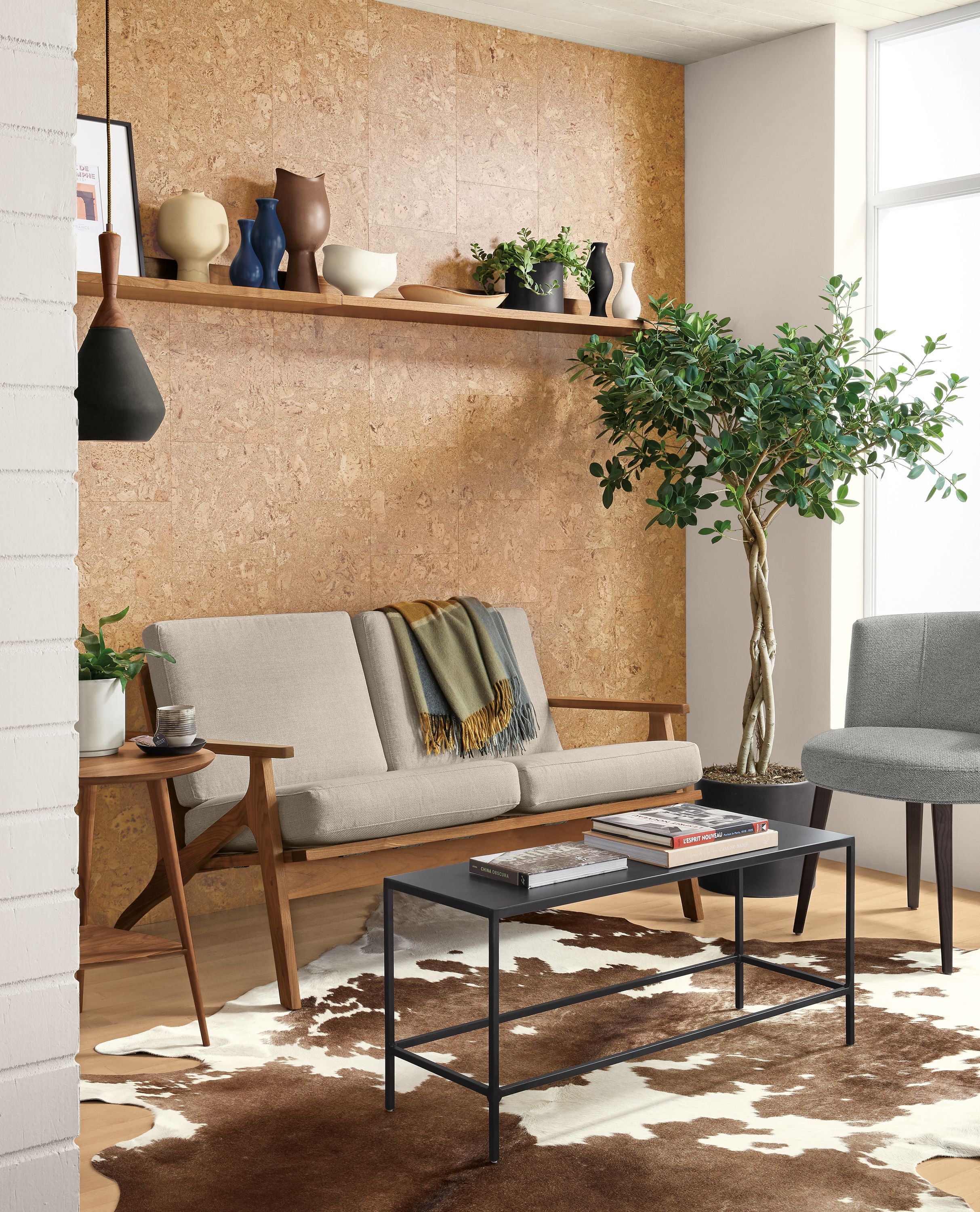 Detail of Sanna sofa in Gino Oatmeal and slim coffee table in natural steel.
