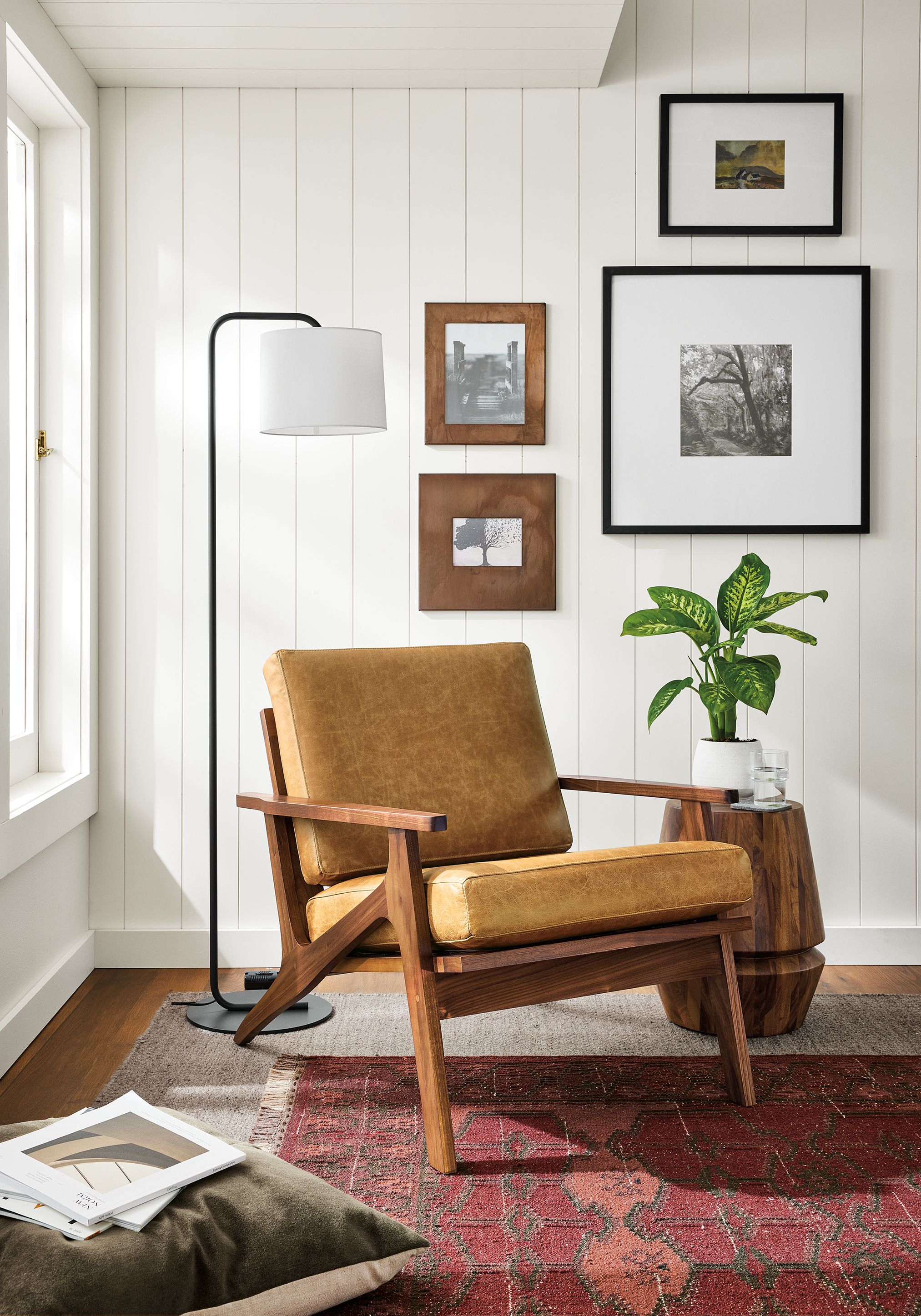 Living room with Sanna chair in Palermo Camel, Nyla 14- diameter table in Conacaste and Avilia 8 by 10 rug in Foxhound.