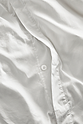 Detail of Tailored Sateen Full-Queen Duvet Cover in White.